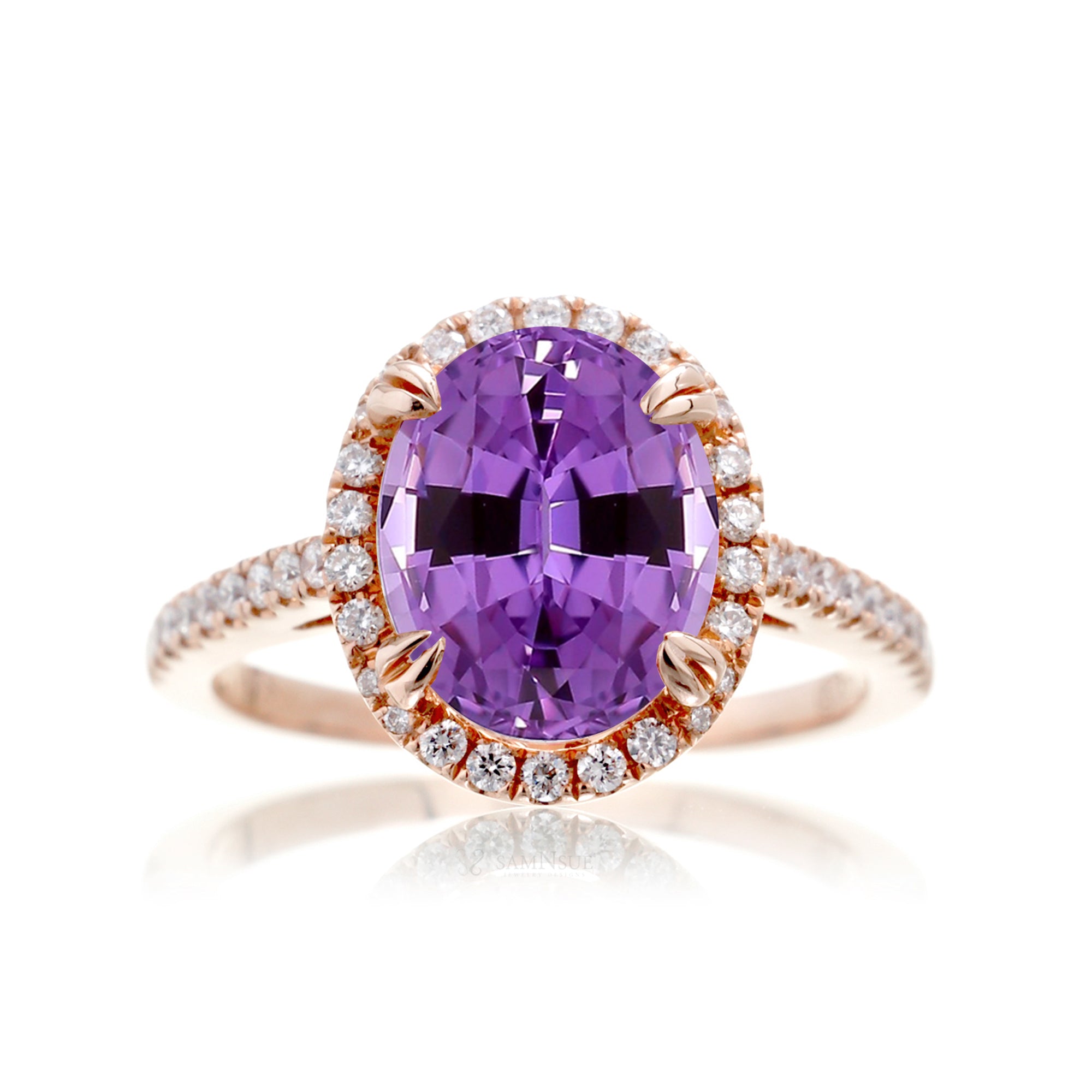 Oval cut amethyst purple sapphire engagement ring with a diamond halo in rose gold