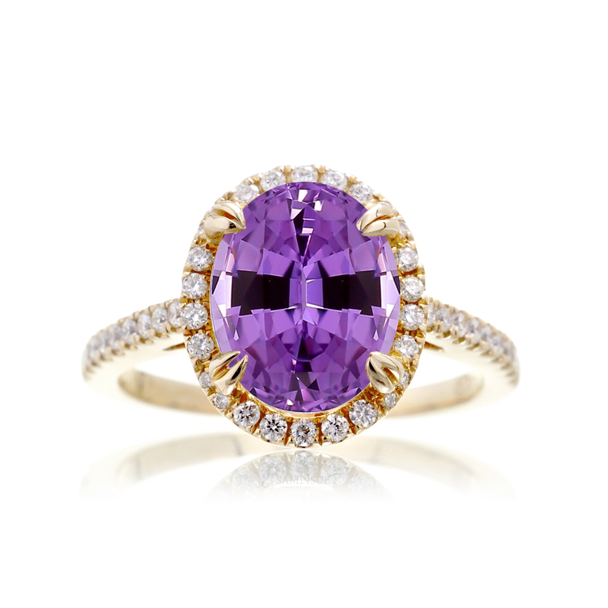 Oval cut amethyst purple sapphire engagement ring with a diamond halo in yellow gold