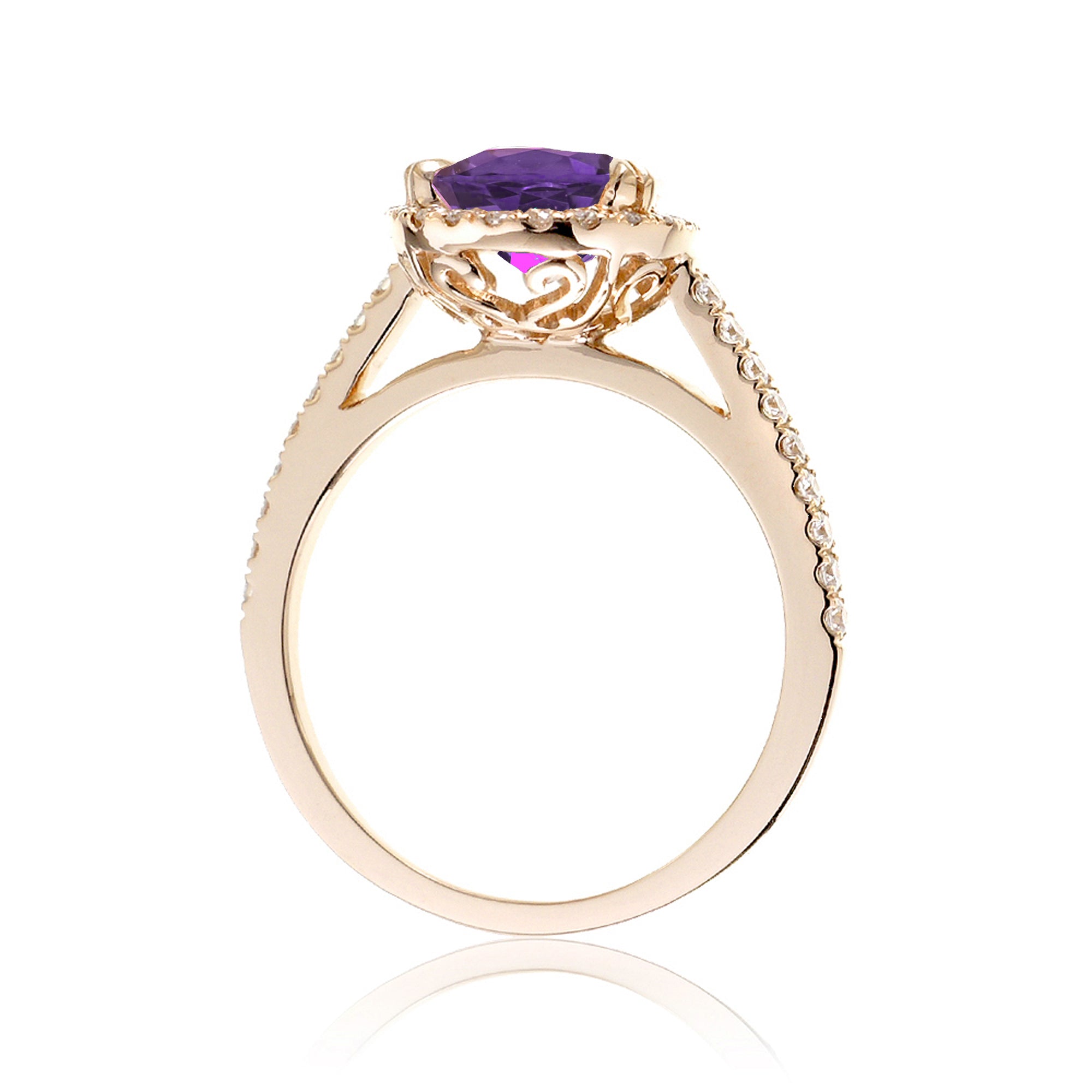 Oval cut amethyst purple sapphire engagement ring with a diamond halo in yellow gold