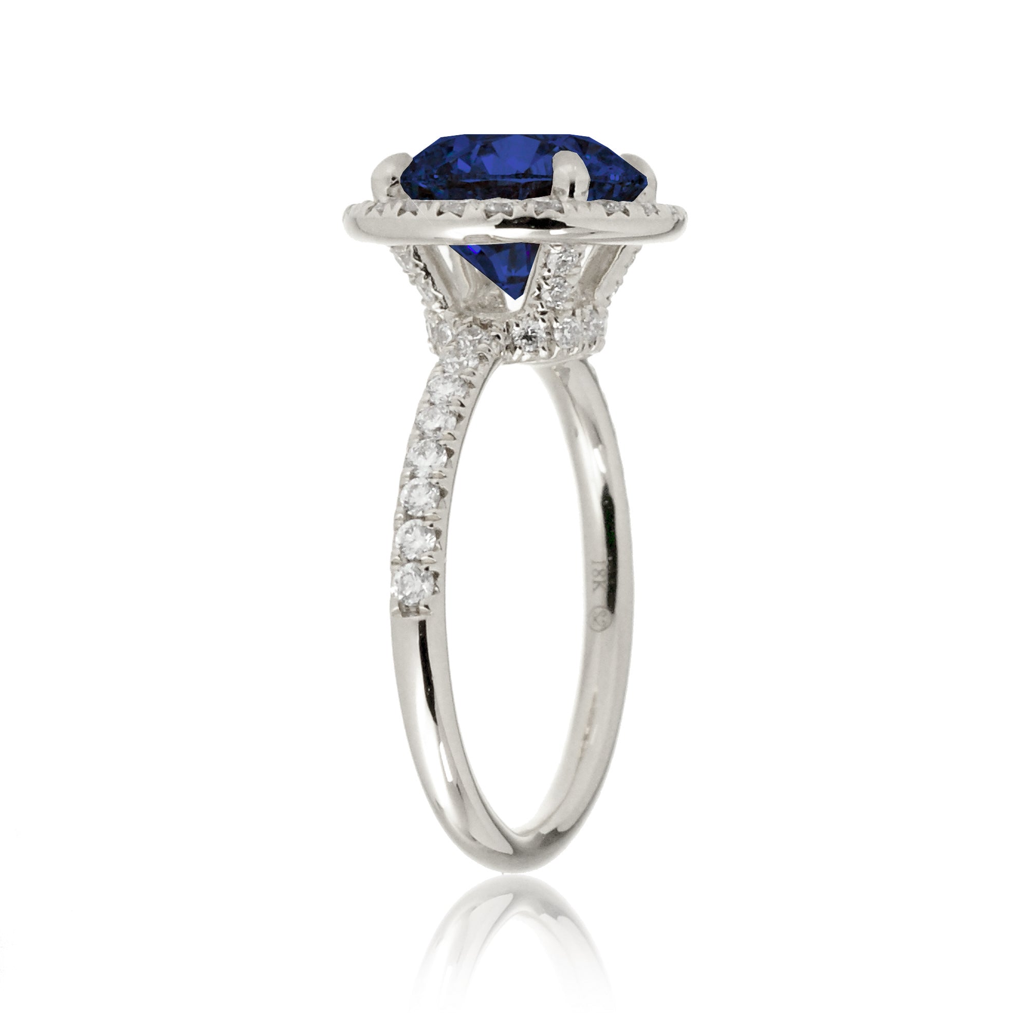 Round blue sapphire engagement ring the Drenched white gold profile view