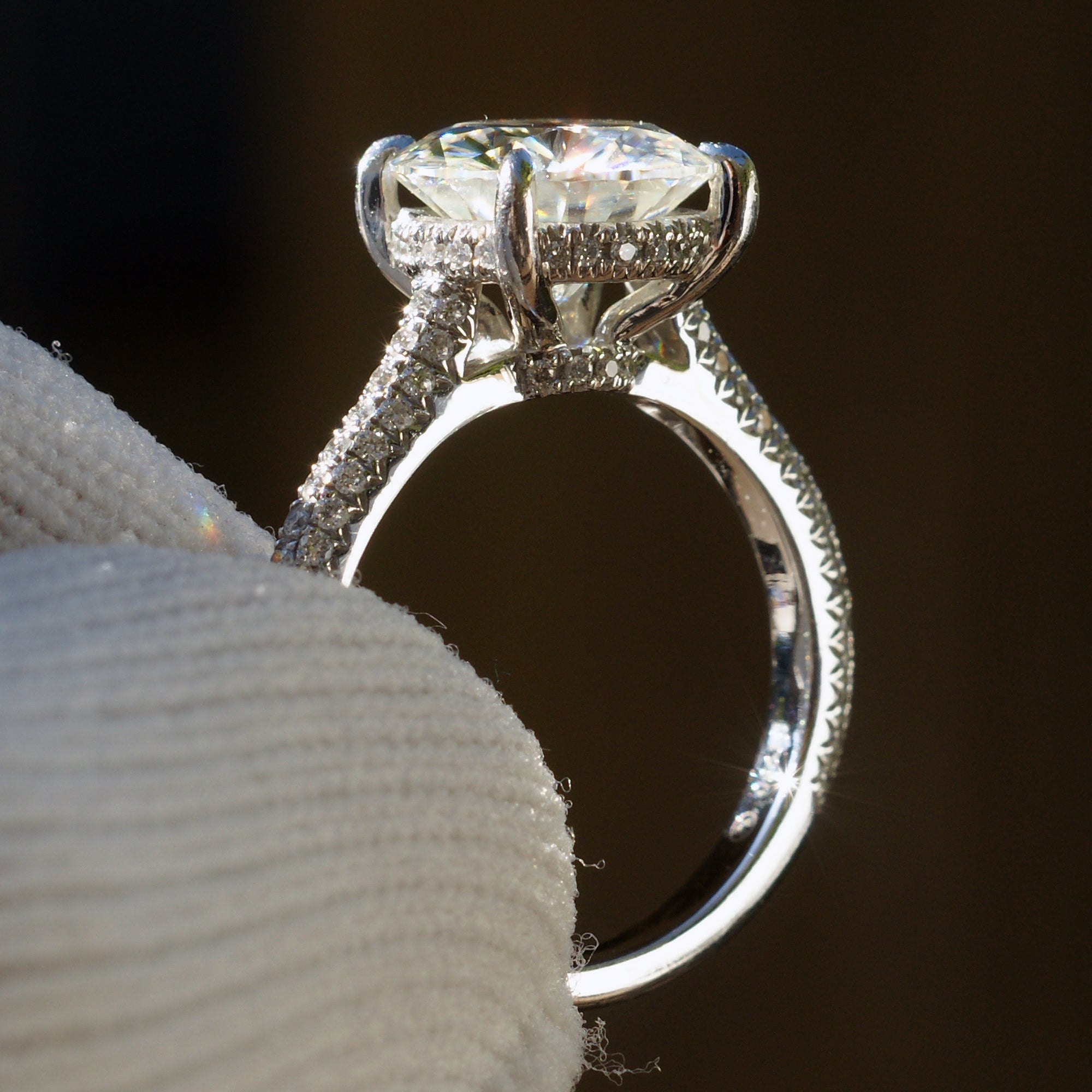 Moissanite engagement ring round cut platinum starlight setting