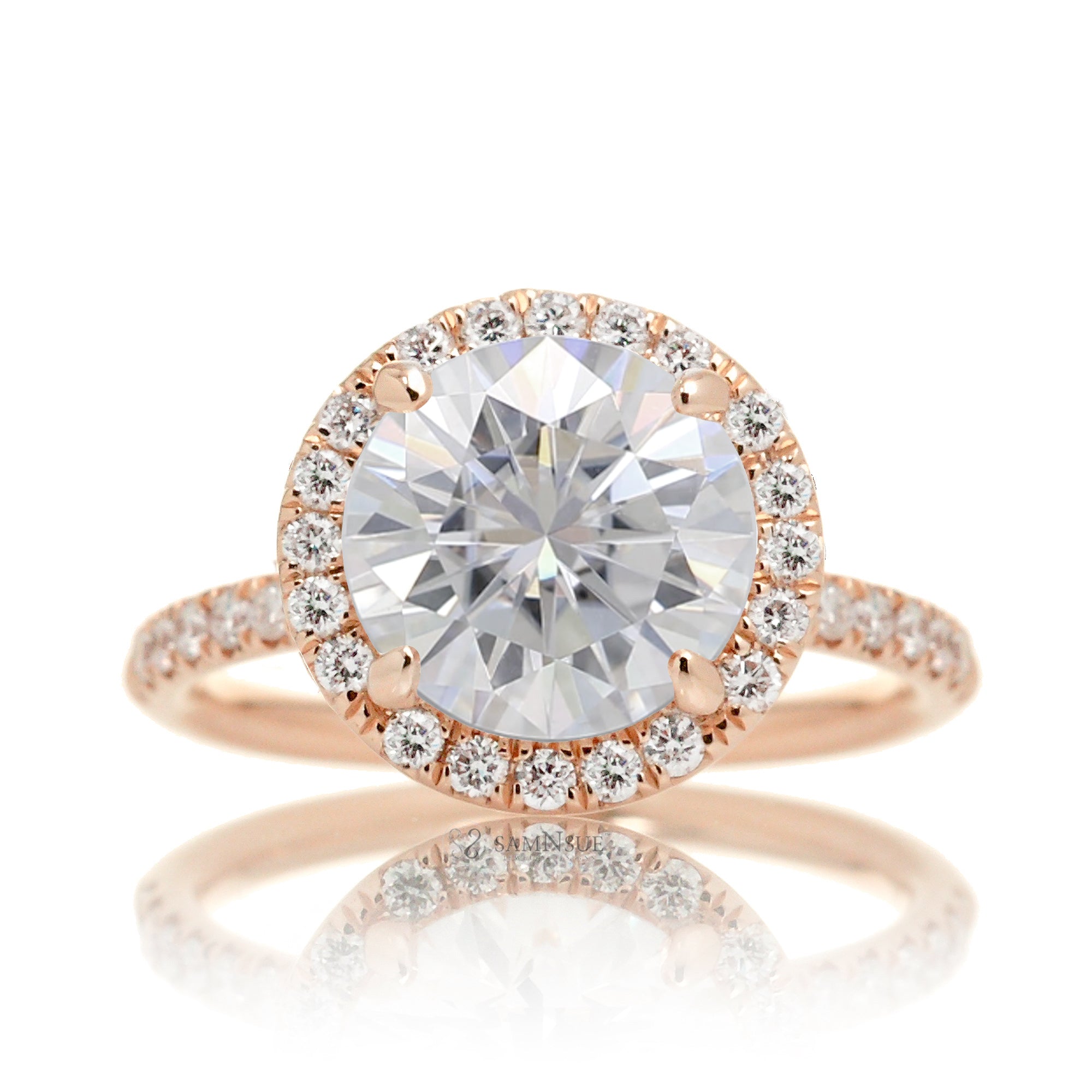 Round brilliant cut moissanite engagement ring with a diamond halo the Drenched rose gold