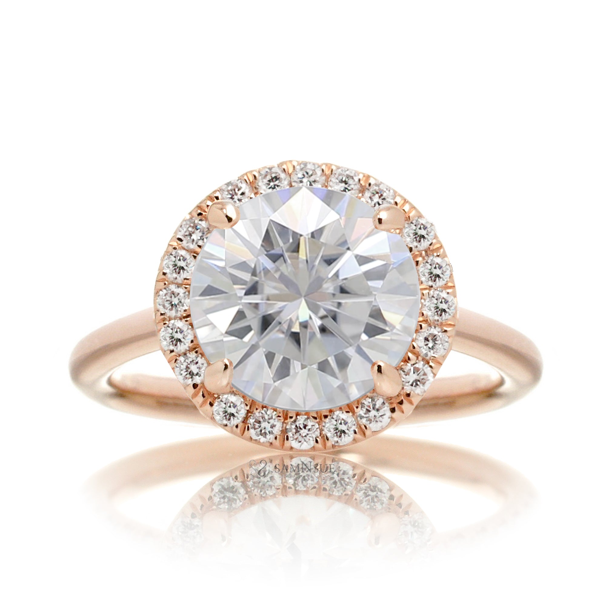 Round brilliant cut moissanite engagement ring with a diamond halo the Drenched rose gold solid band