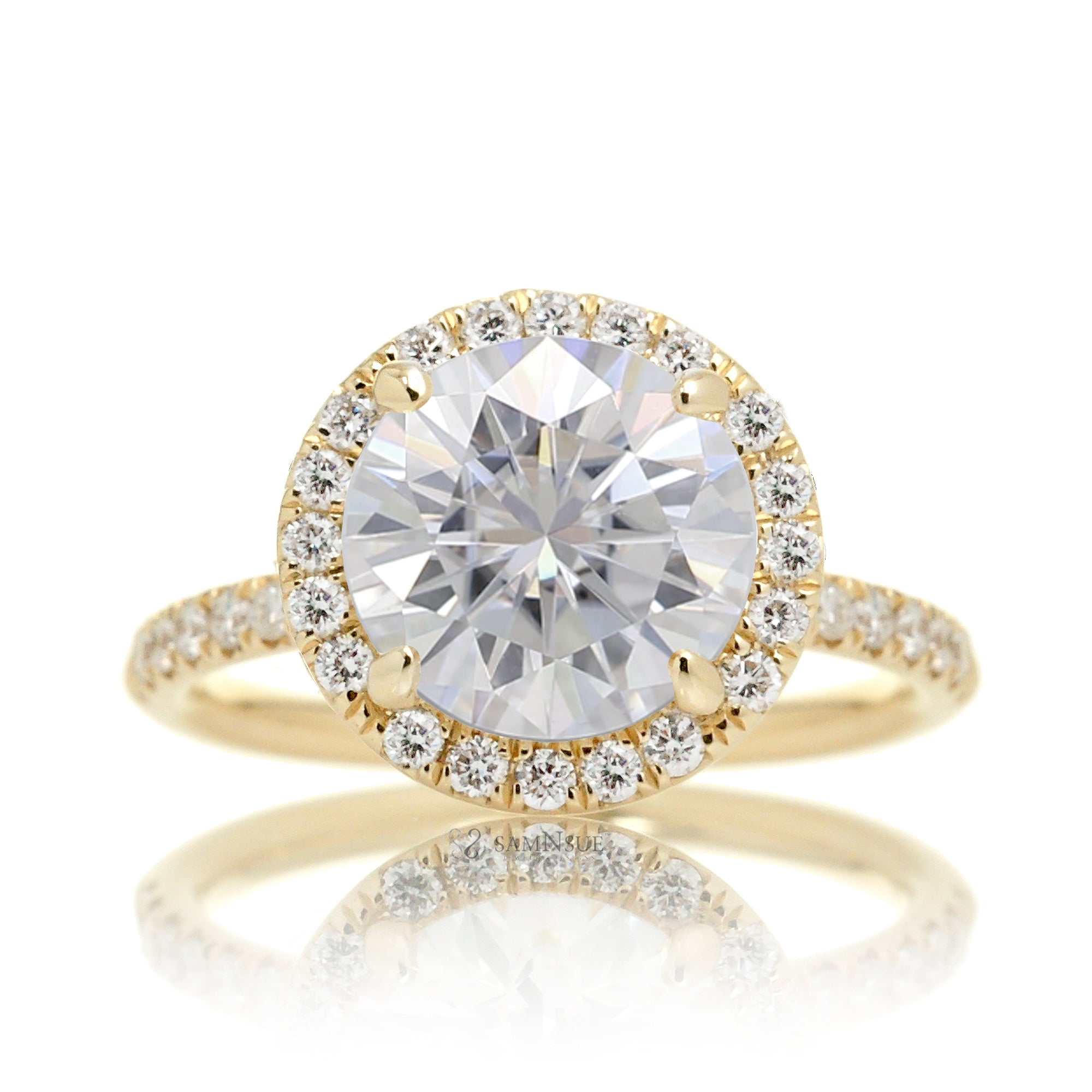 Round brilliant cut moissanite engagement ring with a diamond halo the Drenched yellow gold