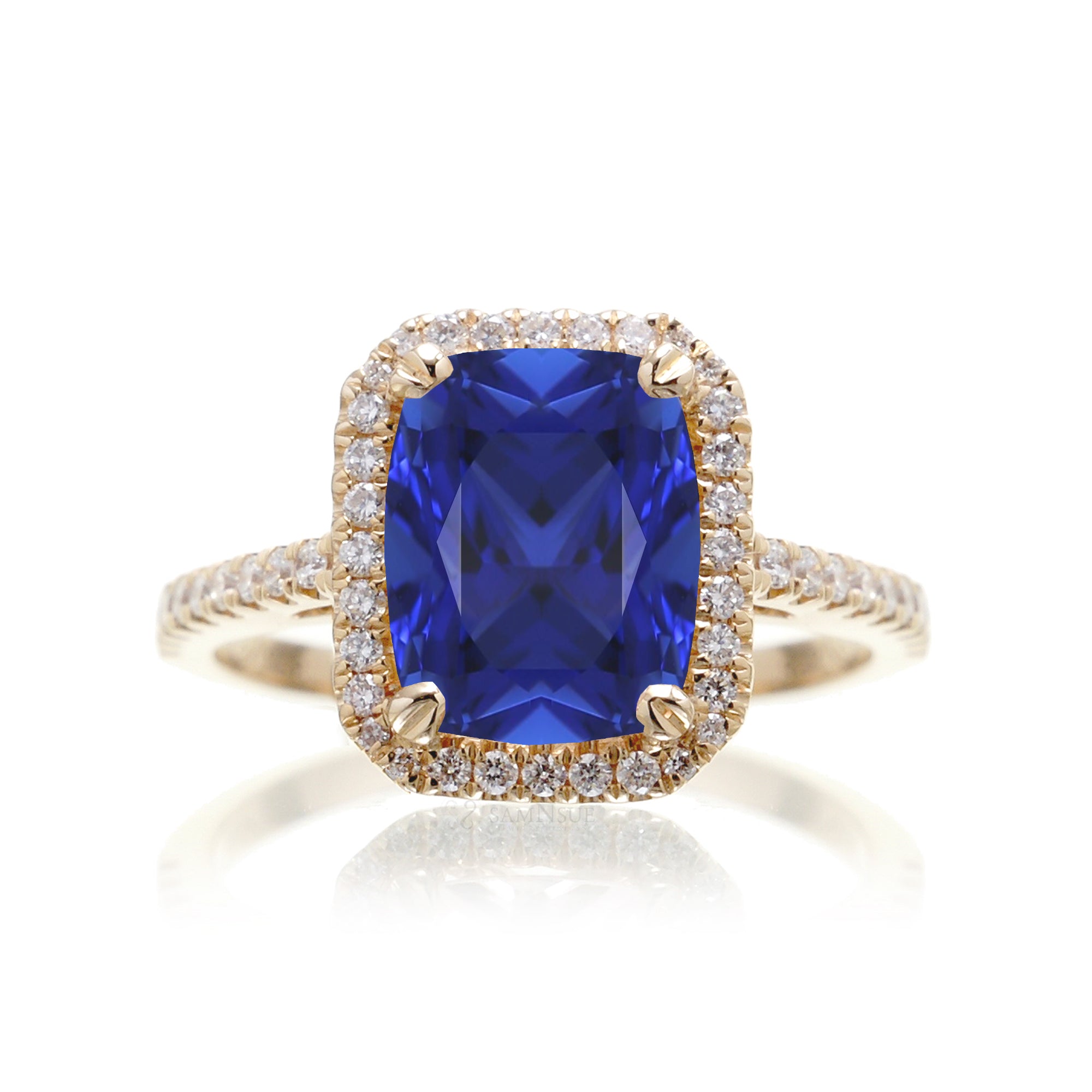 Cushion cut blue sapphire diamond halo ring The Signature in yellow gold