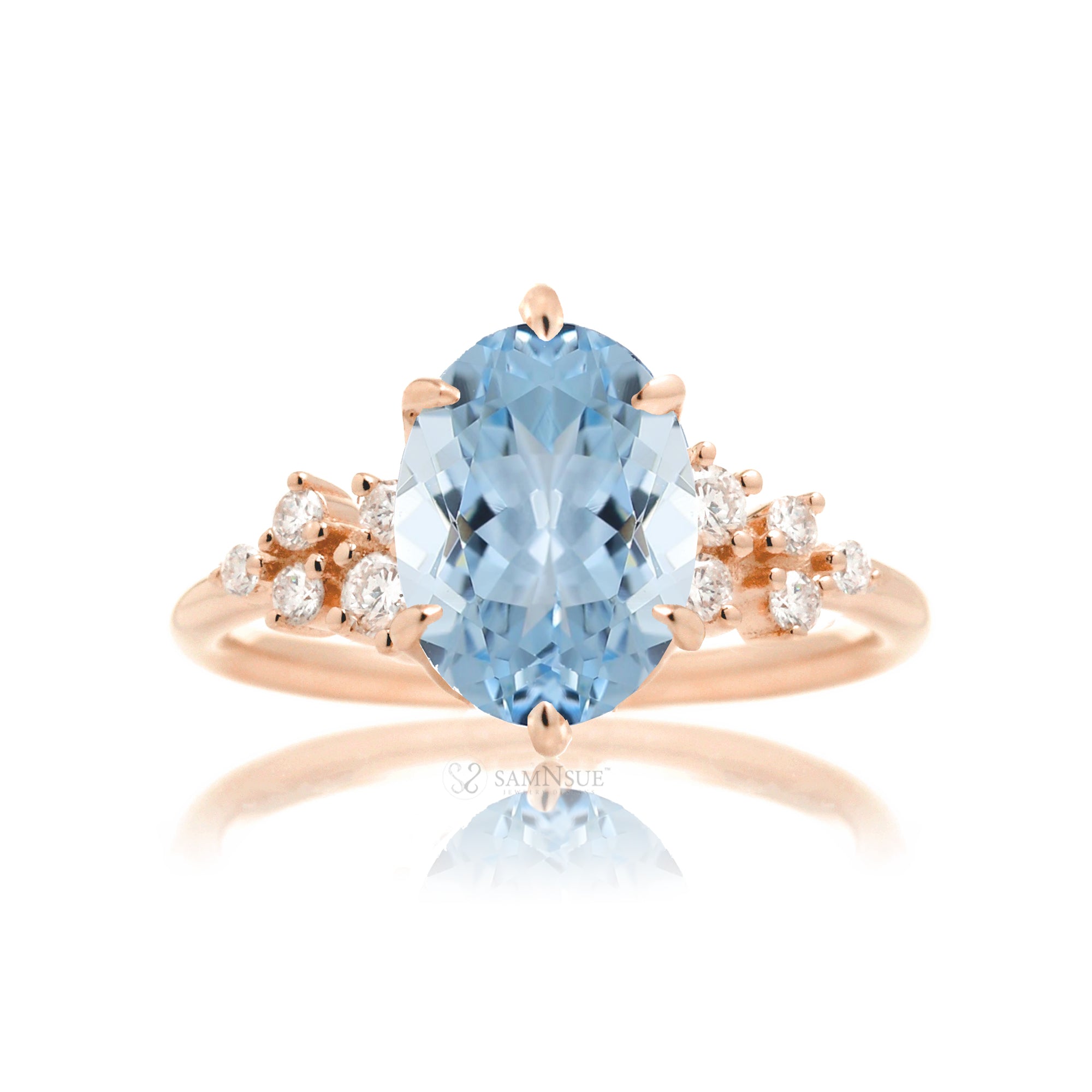 Aquamarine ring with oval center stone and side accent diamonds in rose gold