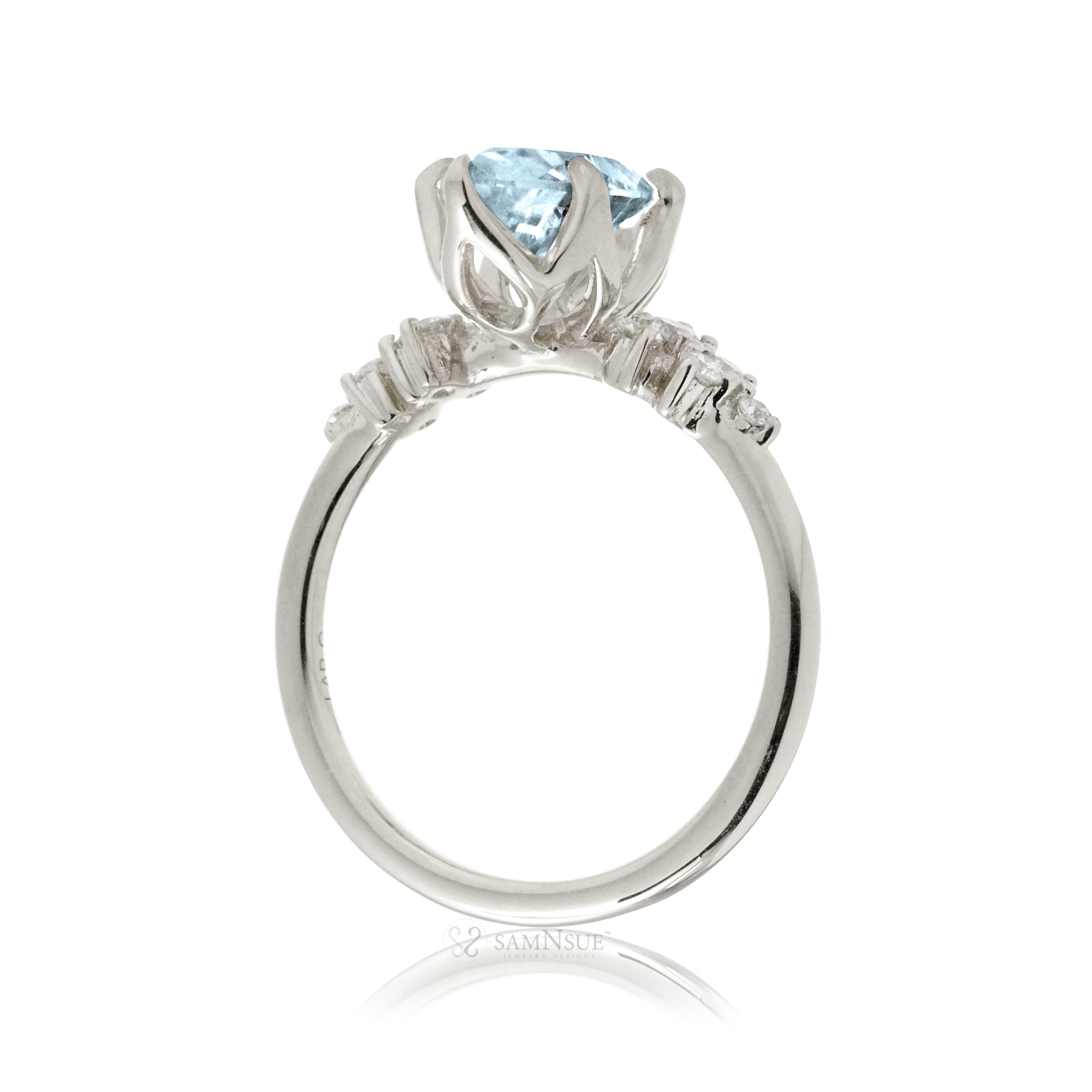 Aquamarine ring with oval center stone and side accent diamonds in white gold