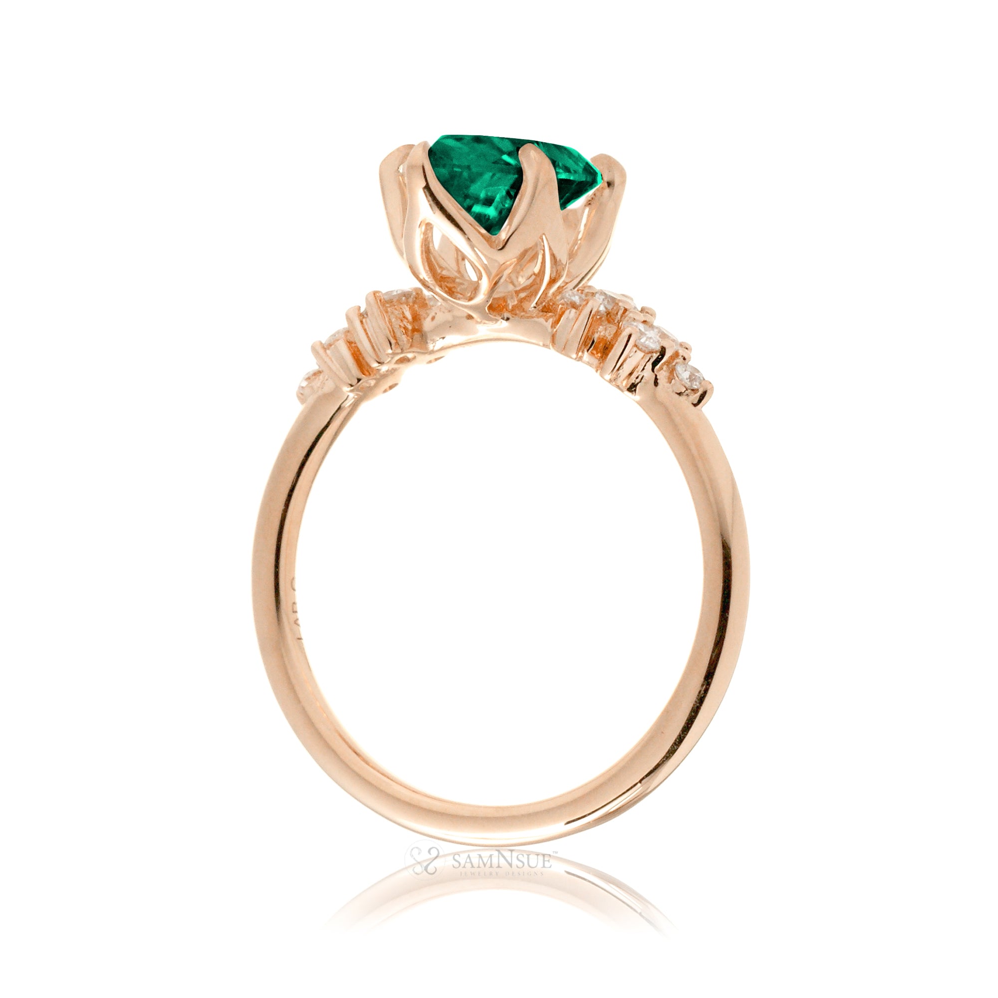 Oval emerald ring with diamond accent on rose  gold