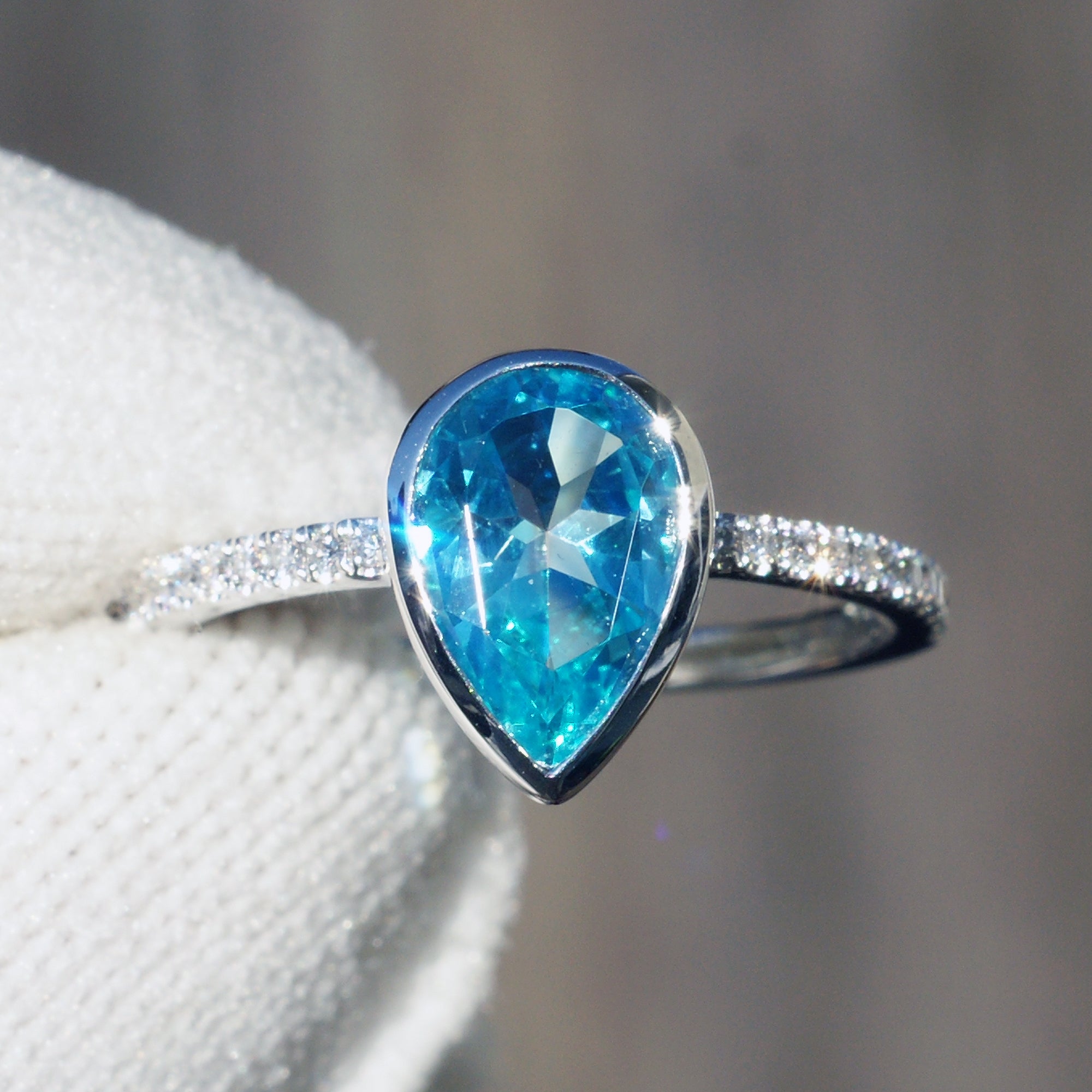 Blue topaz ring pear cut bezel set diamond band ring white gold