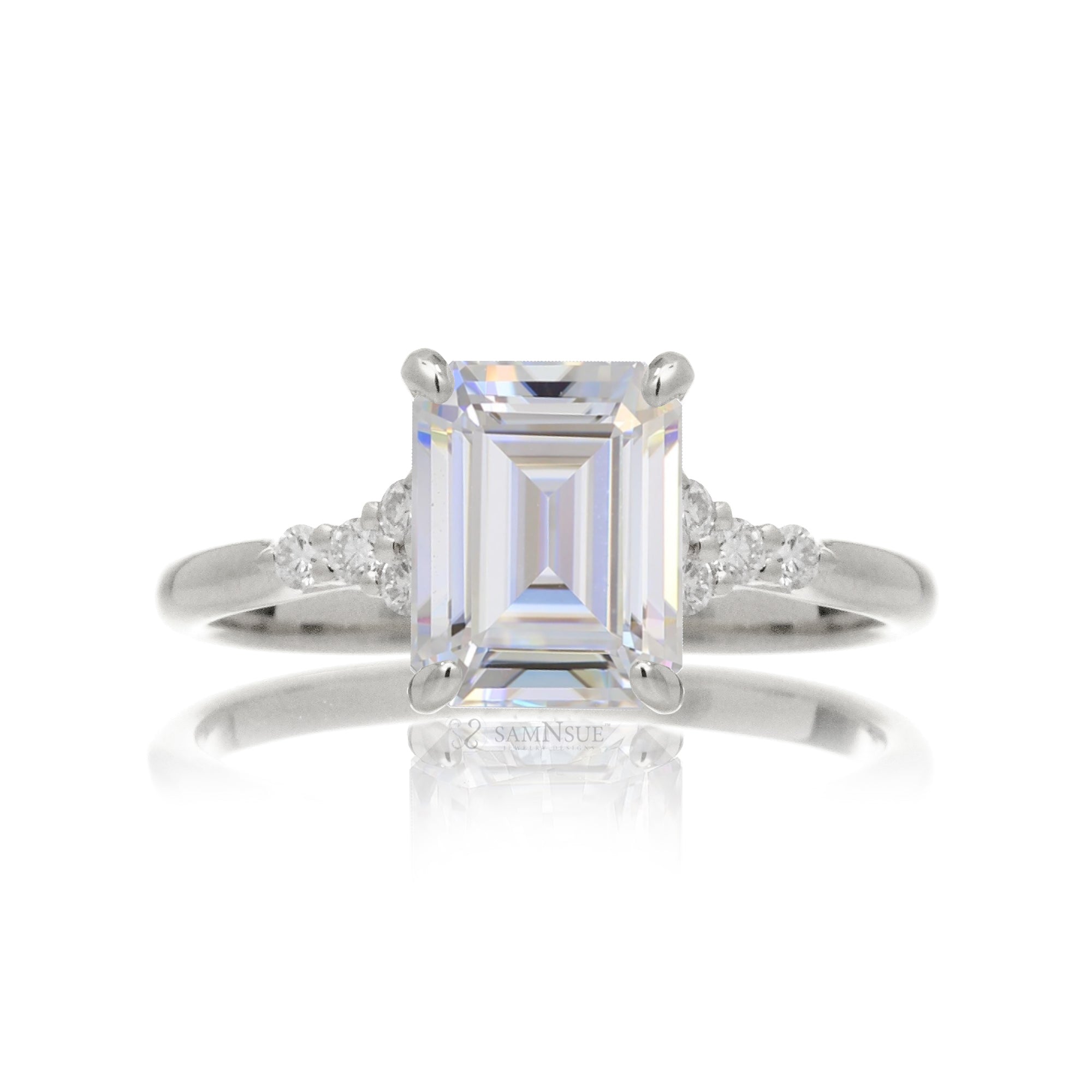 Emerald cut moissanite three stone diamond ring in white gold