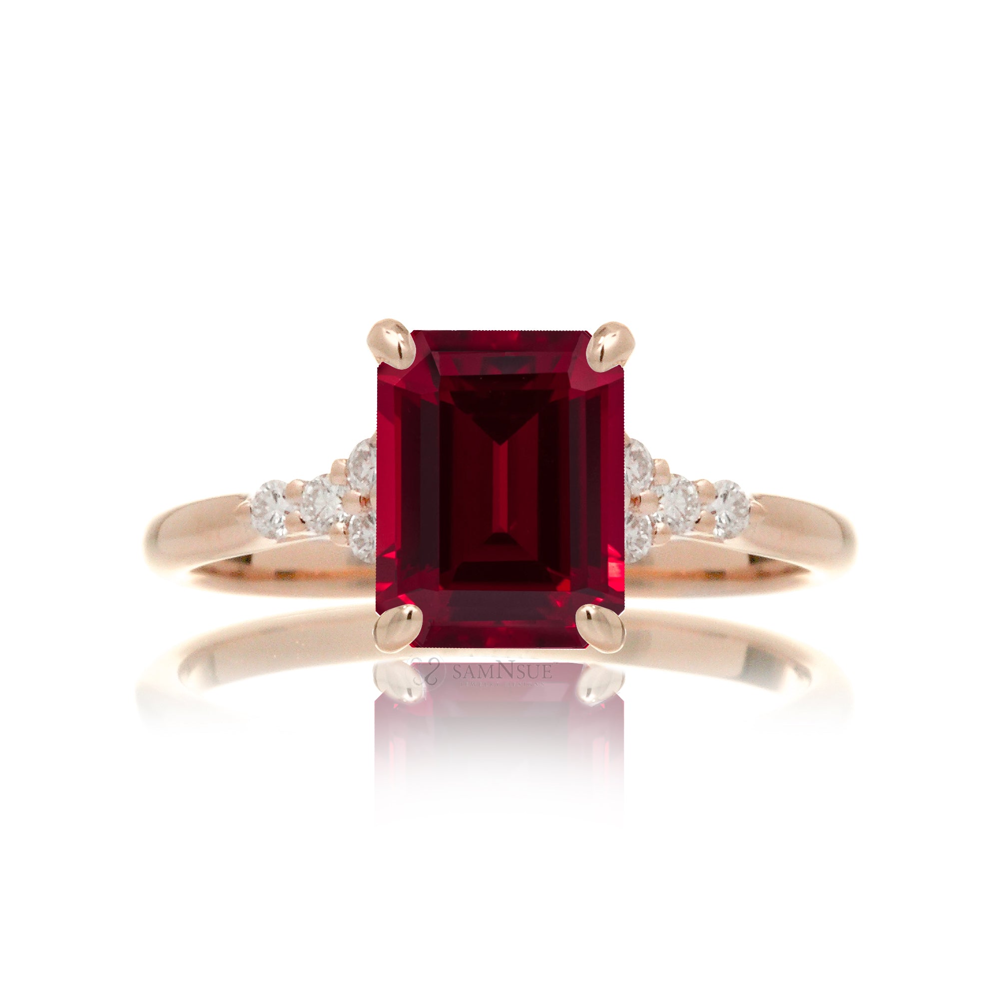 Emerald cut ruby and diamond three stone ring in rose gold