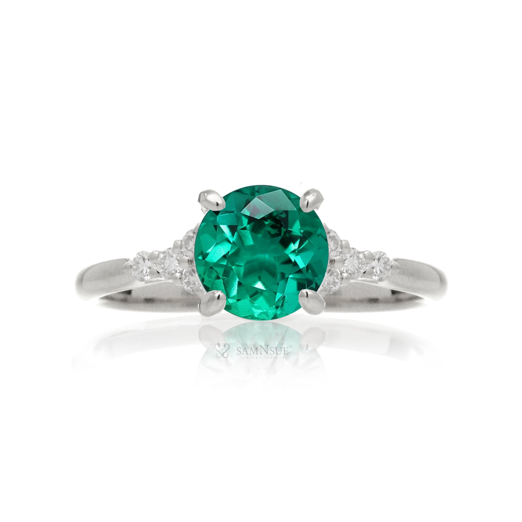 Round cut green emerald and diamond ring in white gold