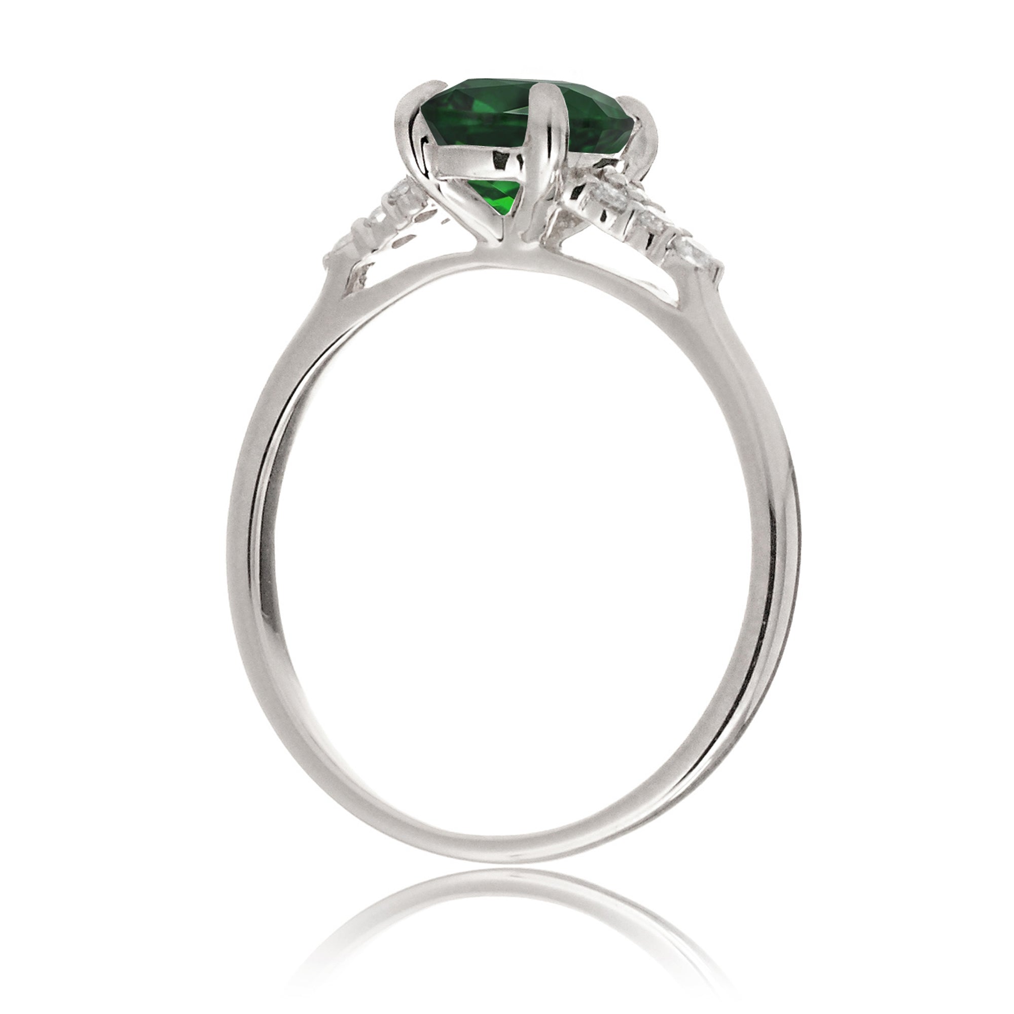 Round cut green emerald and diamond ring in white gold