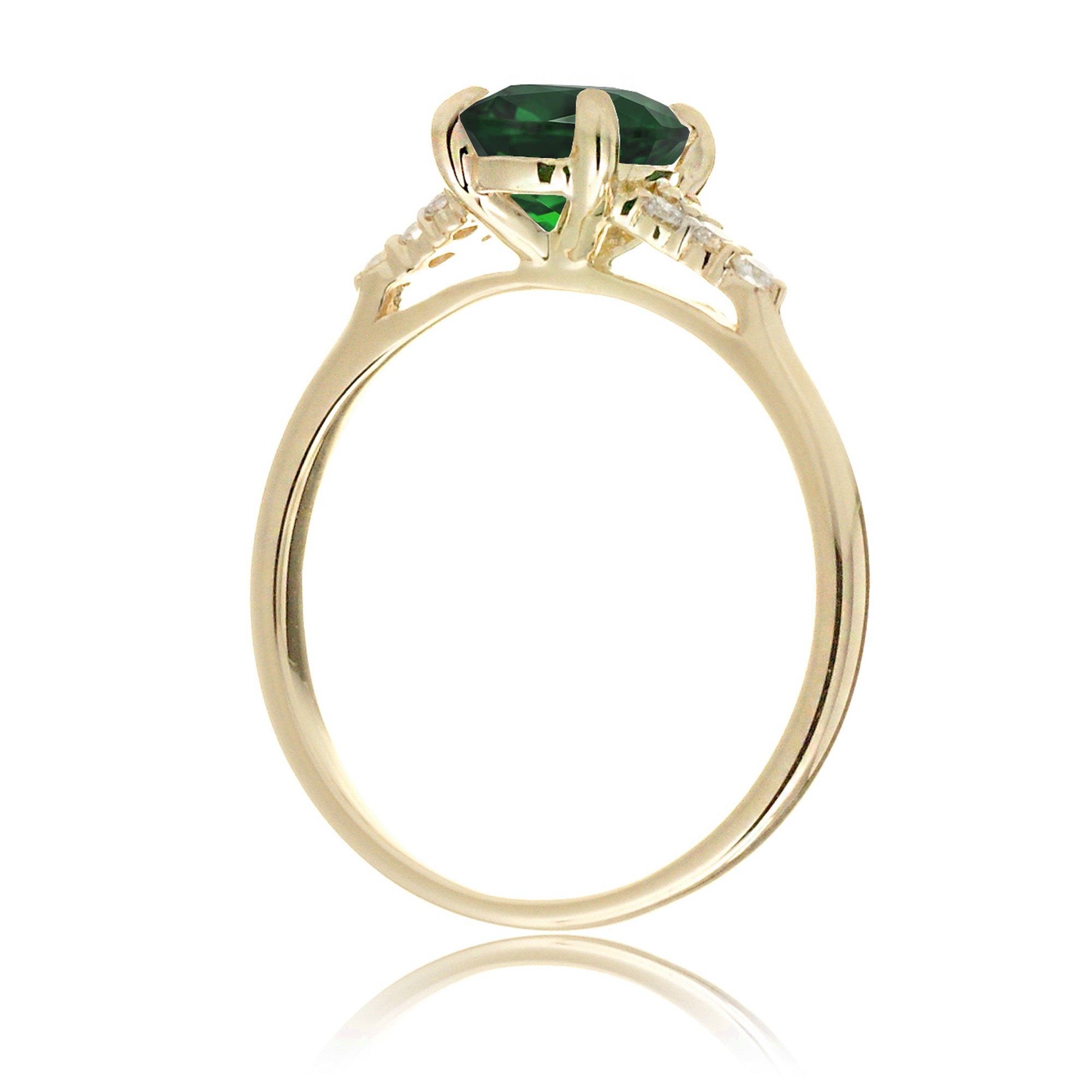 Round cut green emerald and diamond ring in yellow gold