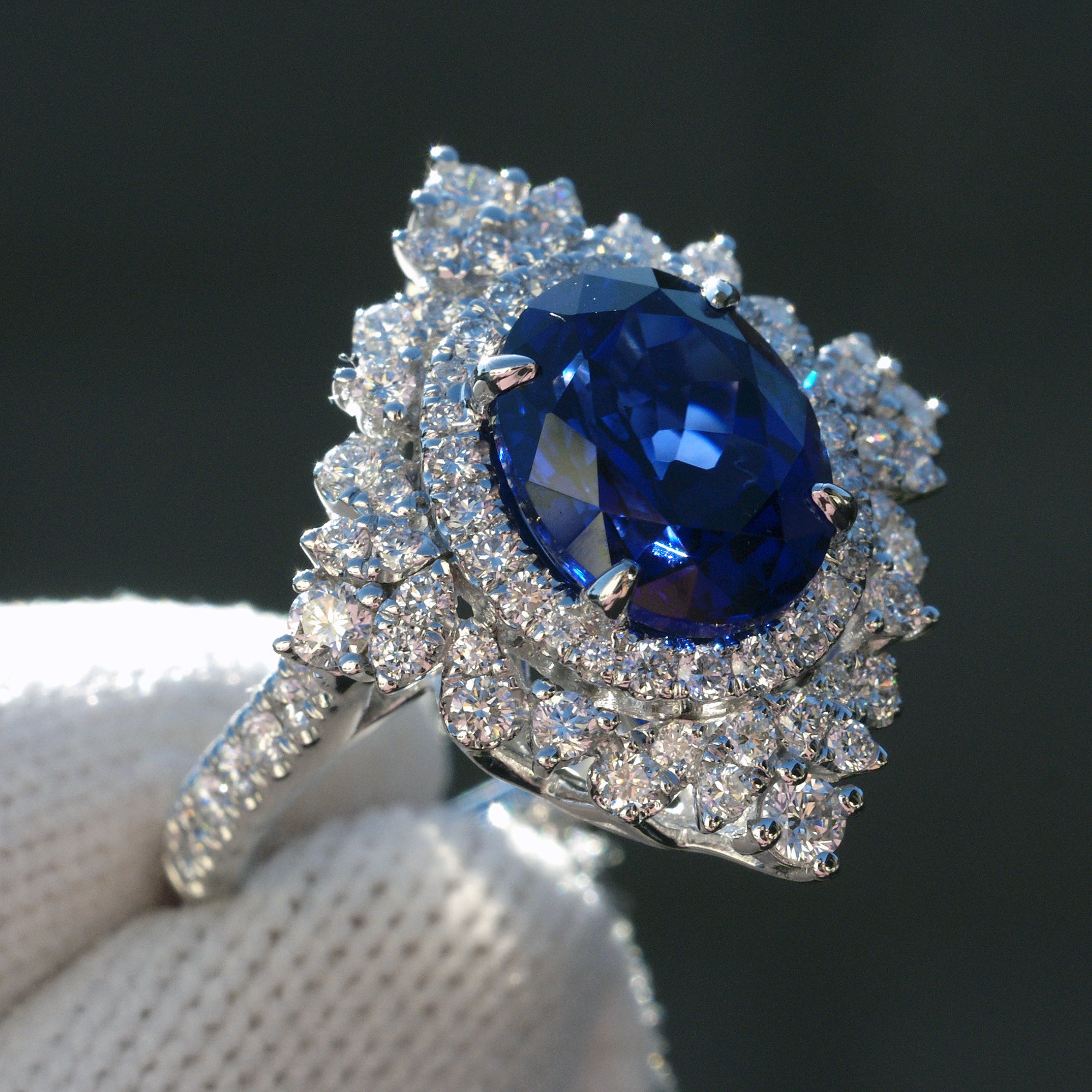 Kate's oval blue sapphire ring with diamond halo in white gold