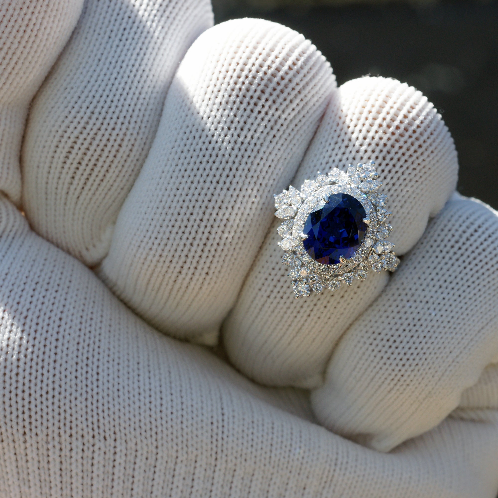 Kate's oval blue sapphire ring with diamond halo in white gold