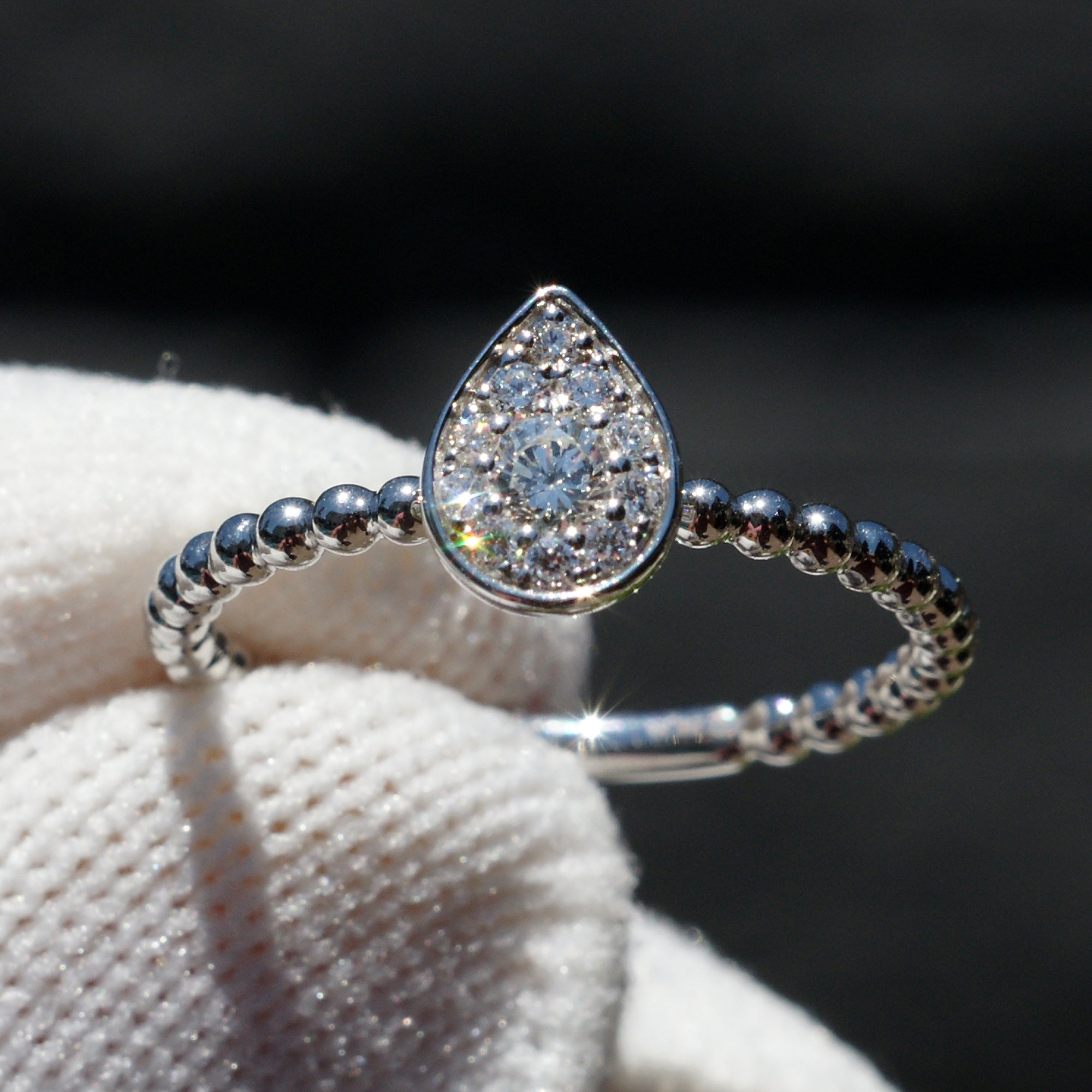 Pear cluster diamond ring with beaded band in white gold