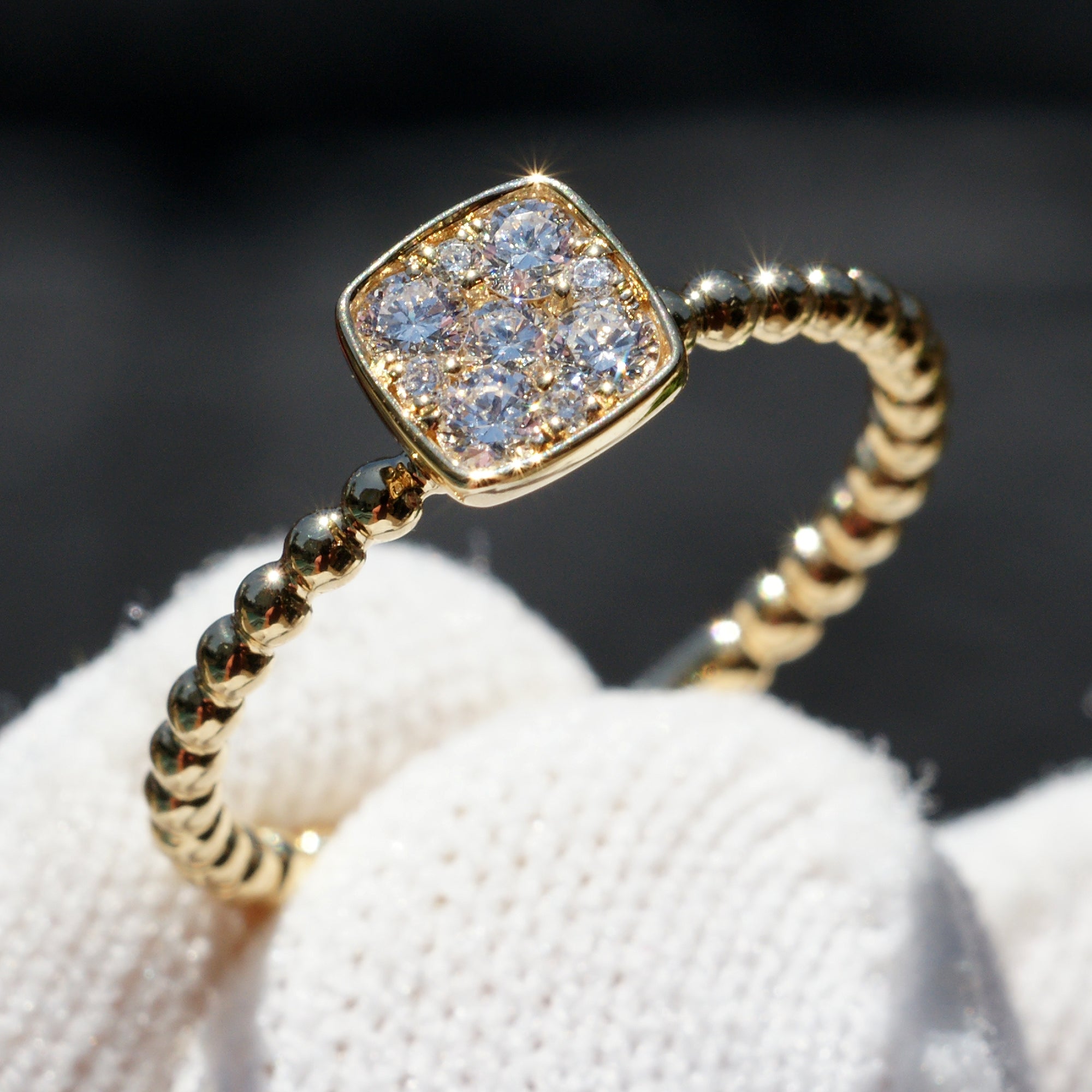 Square cushion cluster diamond solitaire with beaded yellow gold band