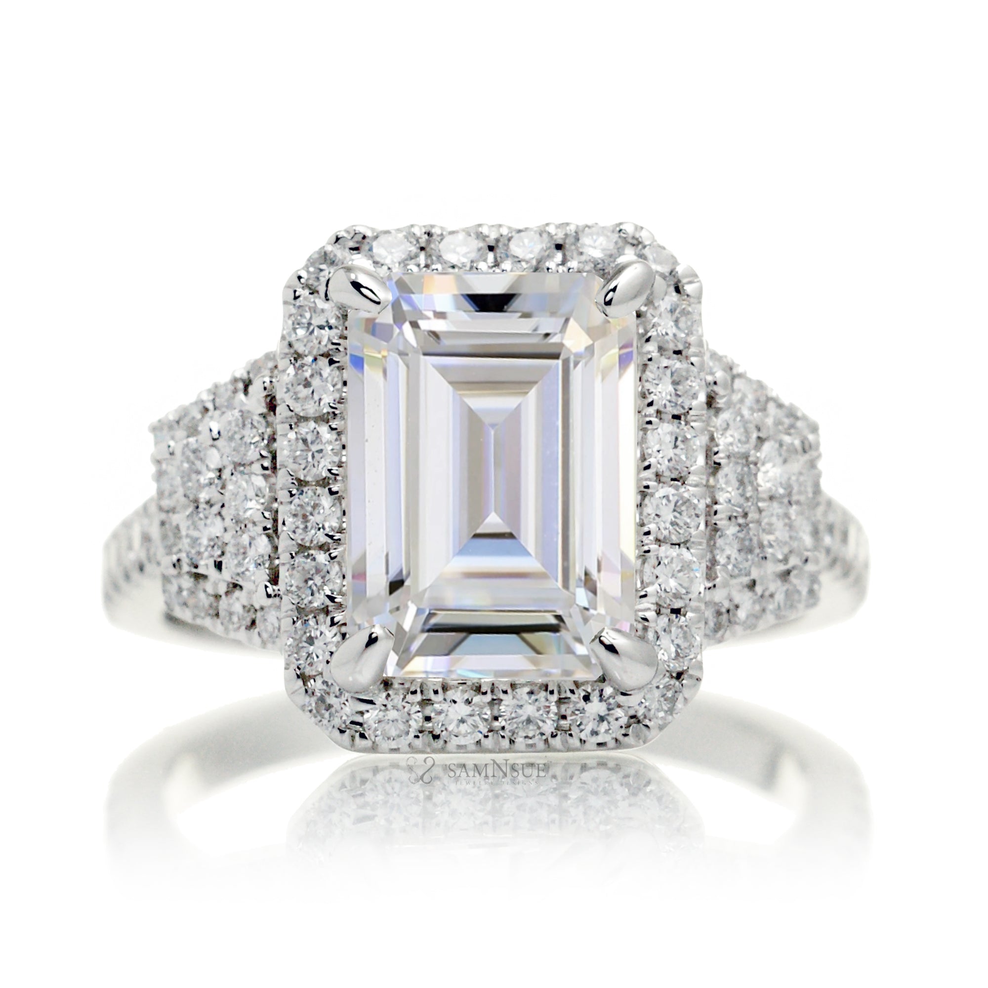 Emerald cut Moissanite diamond halo and trapezoid three stone ring white gold