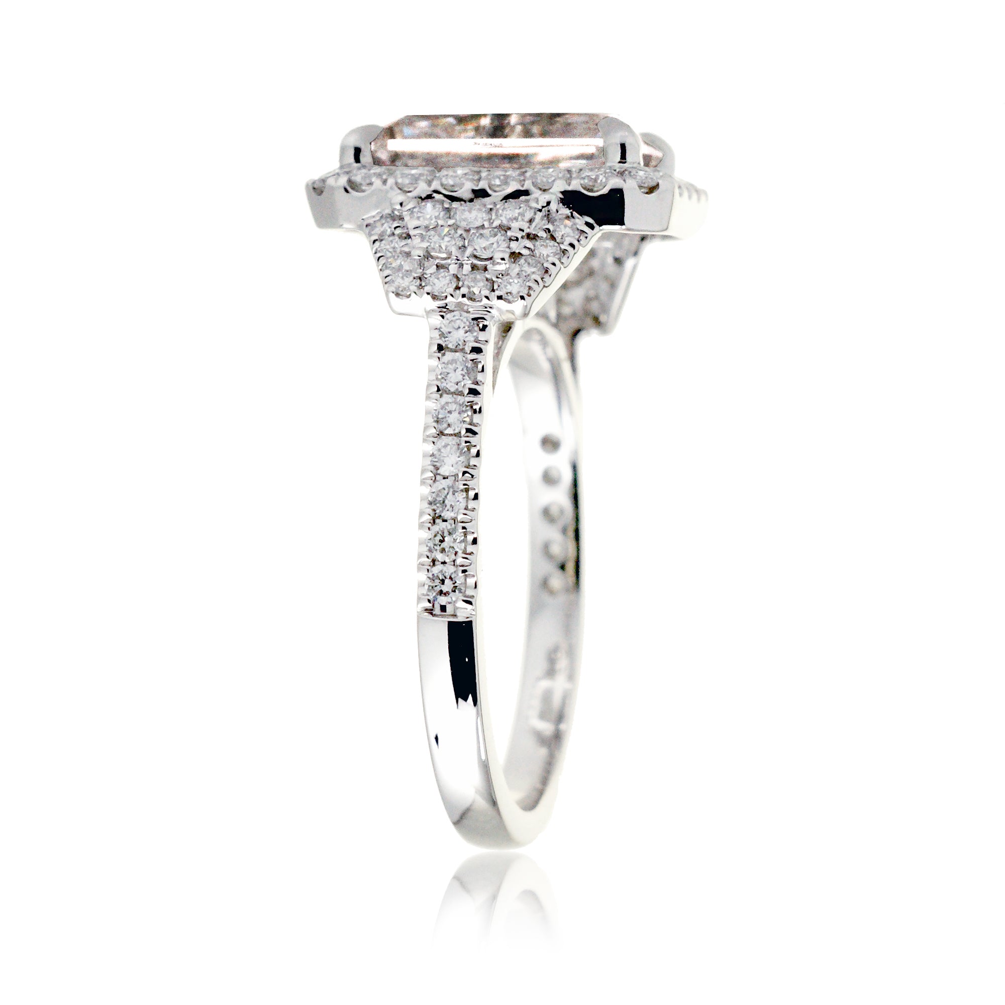 Emerald cut morganite diamond halo and trapezoid three stone ring white gold