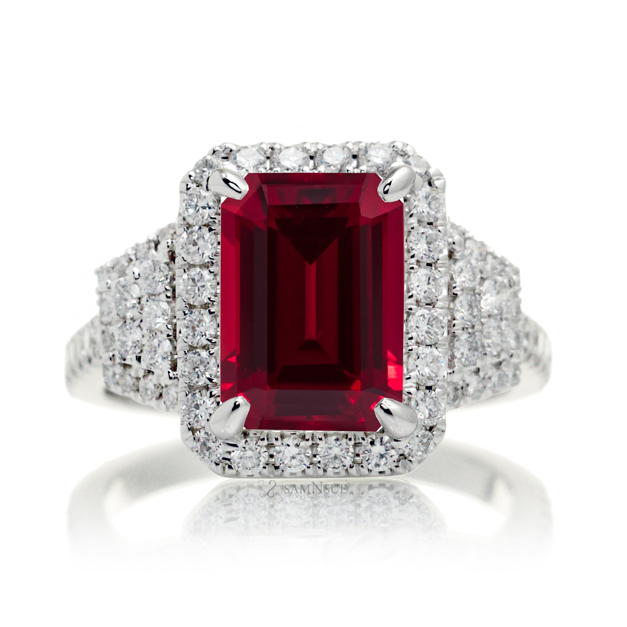 Emerald cut red ruby diamond halo and trapezoid three stone ring white gold