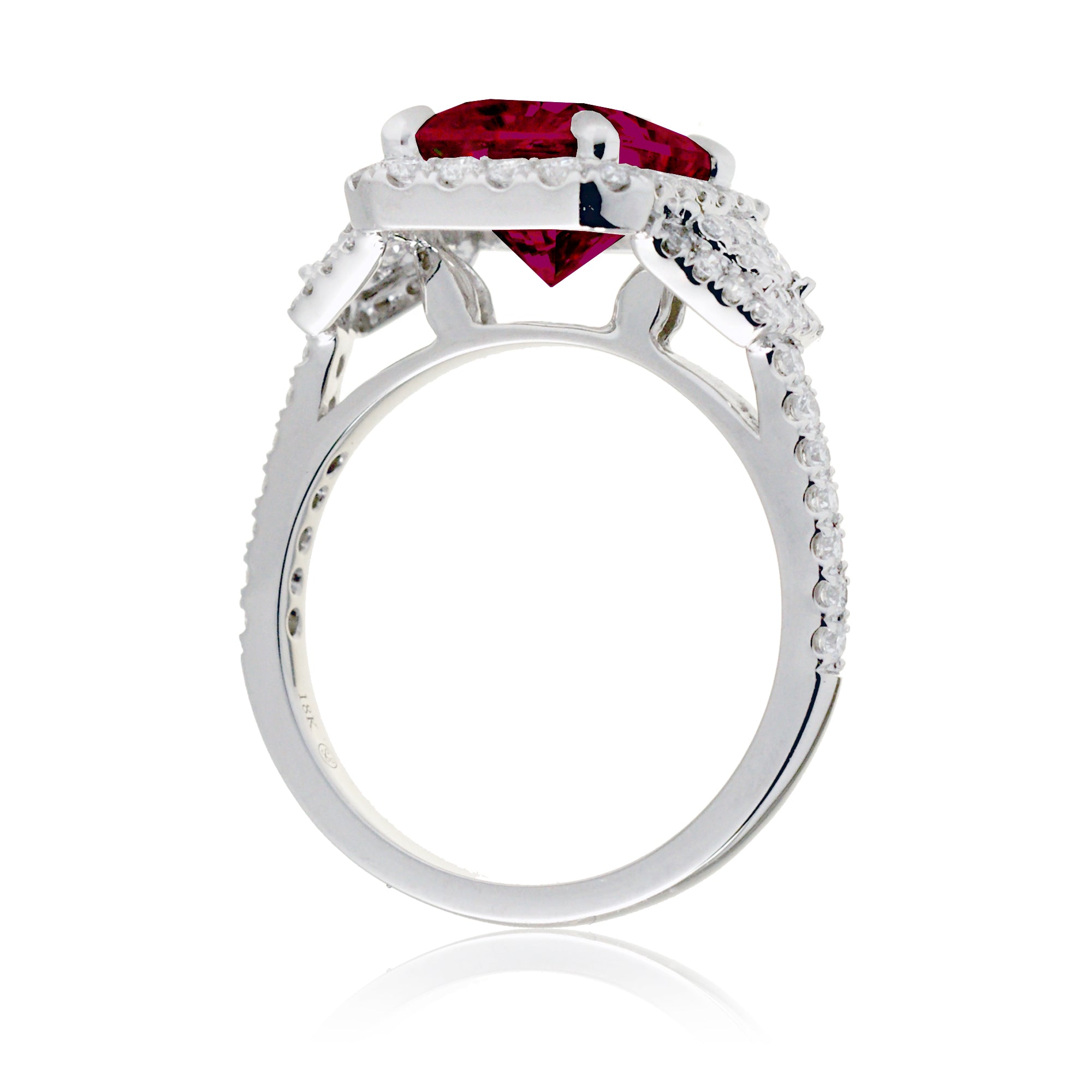 Emerald cut red ruby diamond halo and trapezoid three stone ring white gold