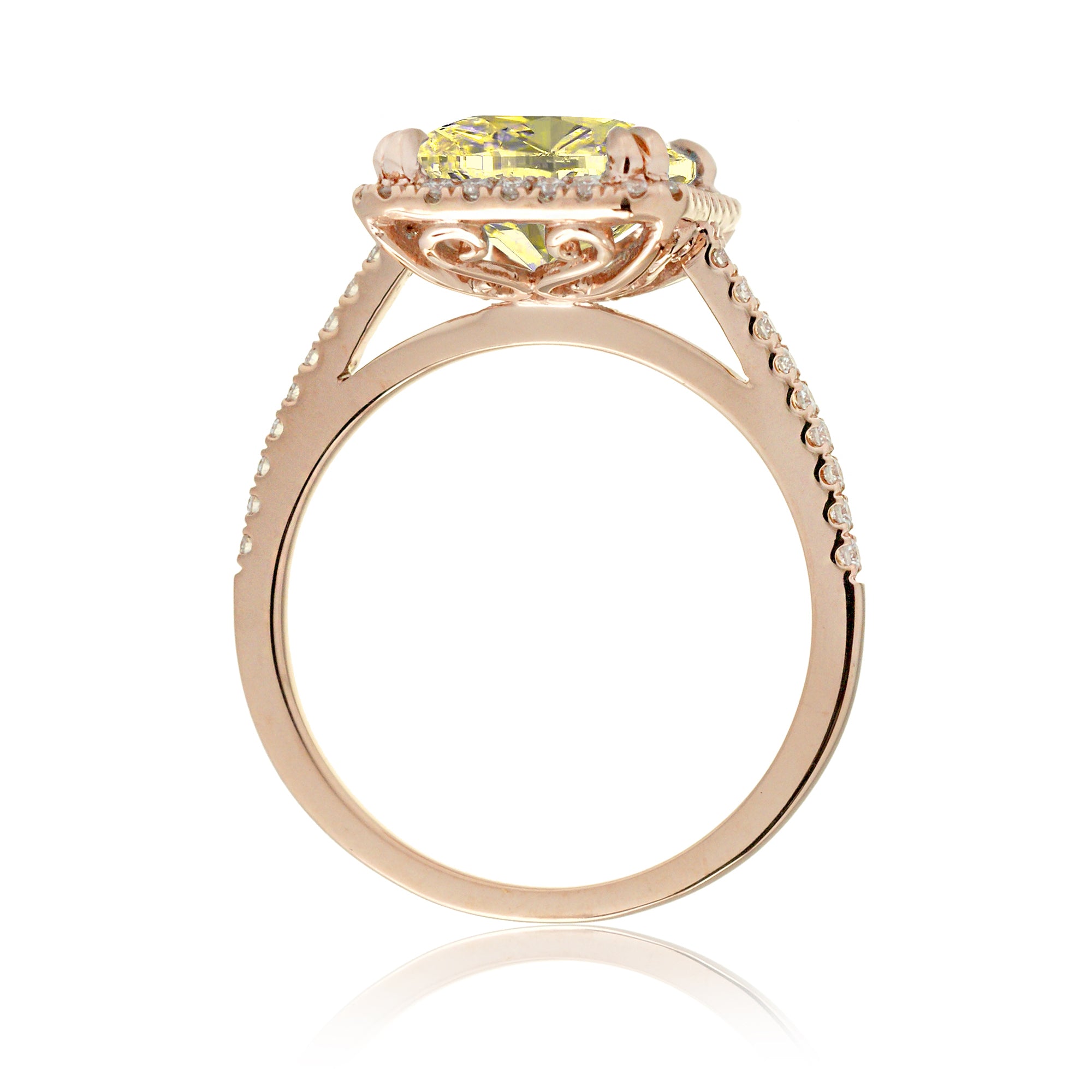 Yellow sapphire emerald cut ring with diamond halo