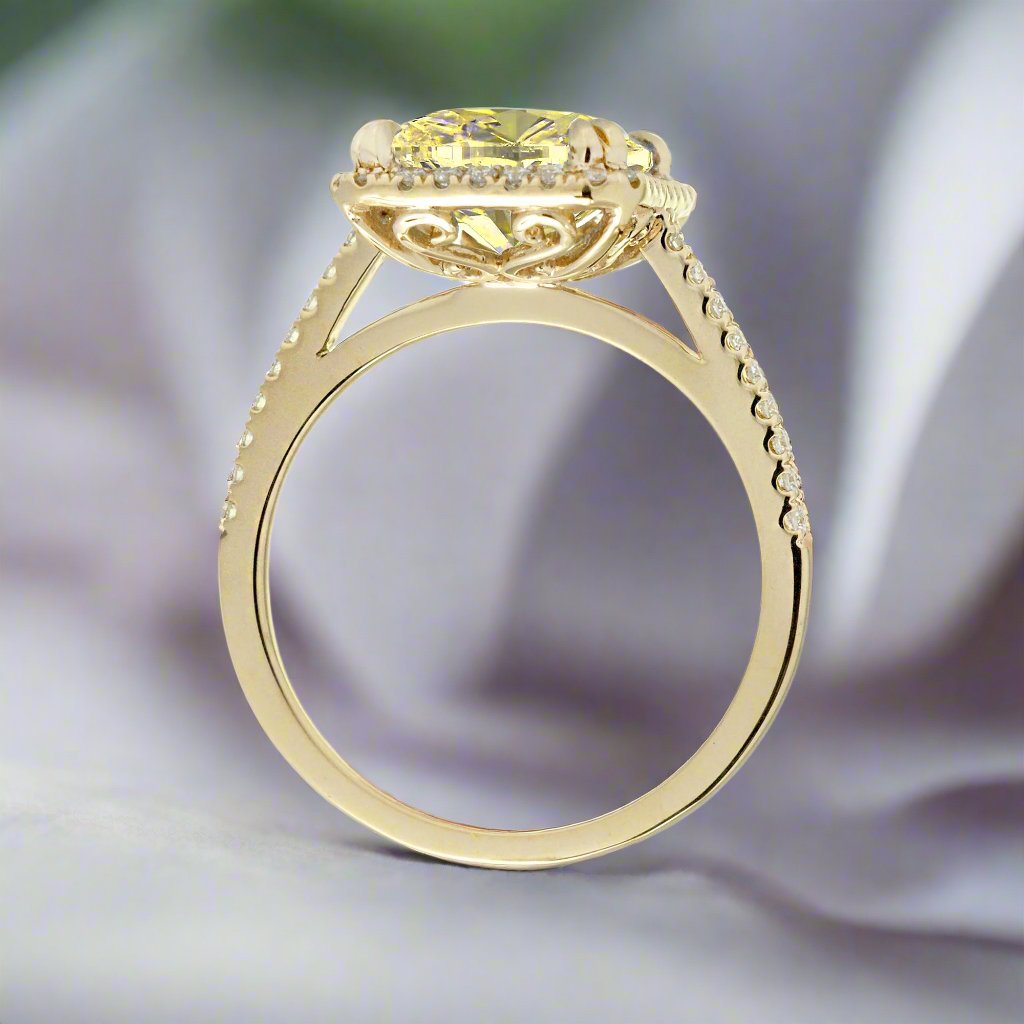 Yellow sapphire emerald cut ring with diamond halo