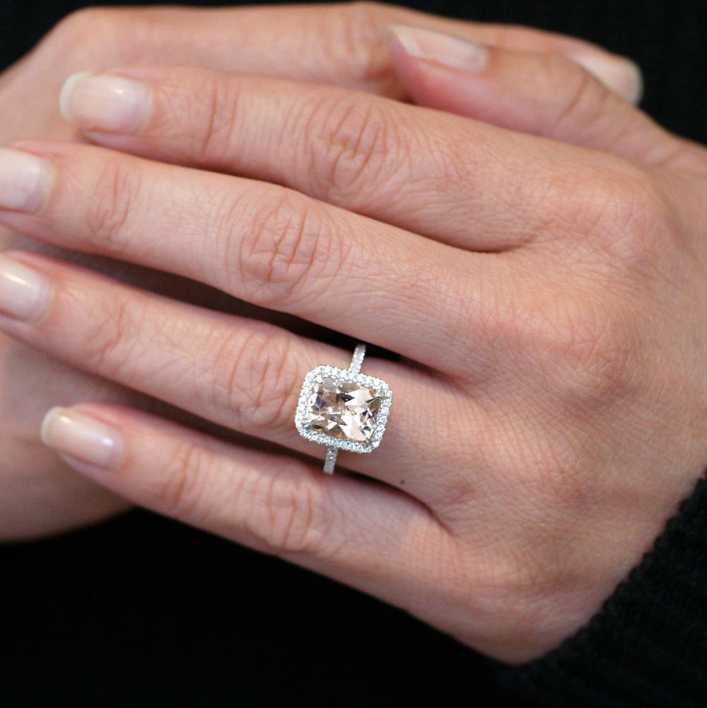 Cushion cut morganite ring with a diamond halo in white gold