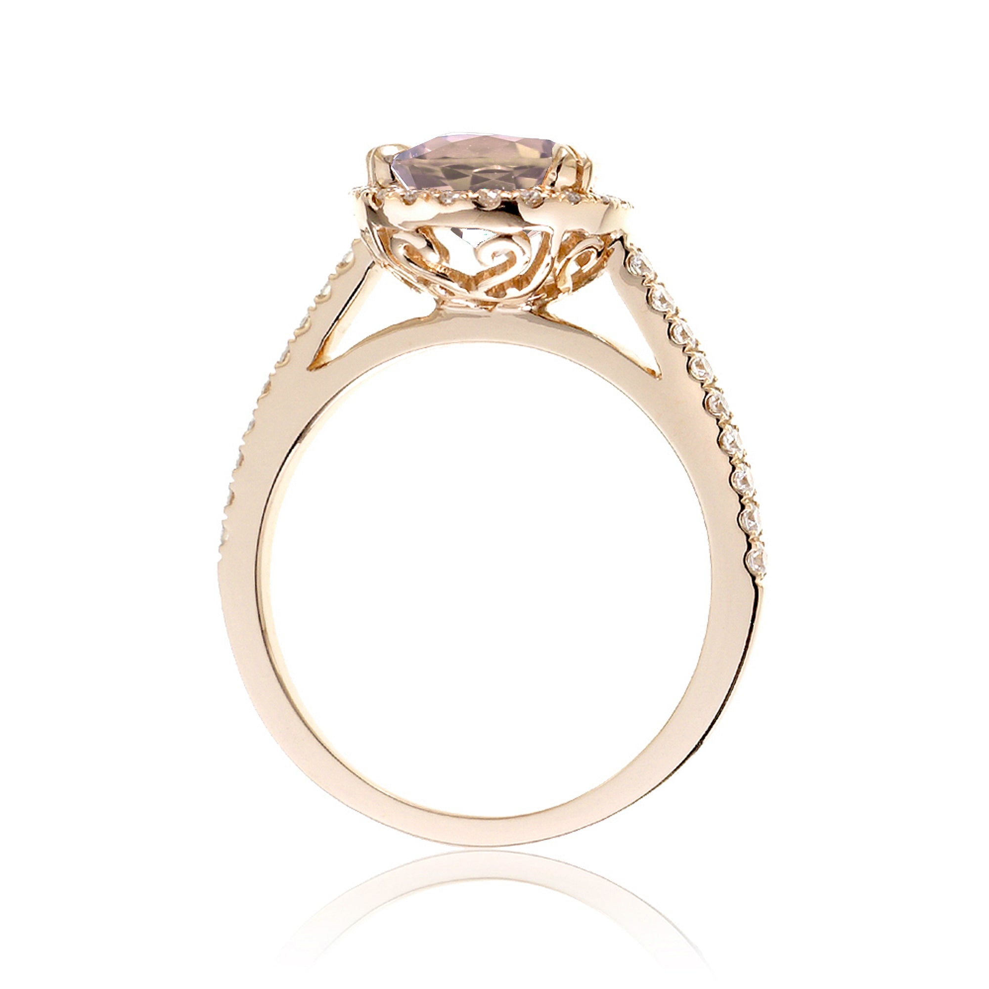 Oval morganite engagement ring with diamond halo in yellow gold