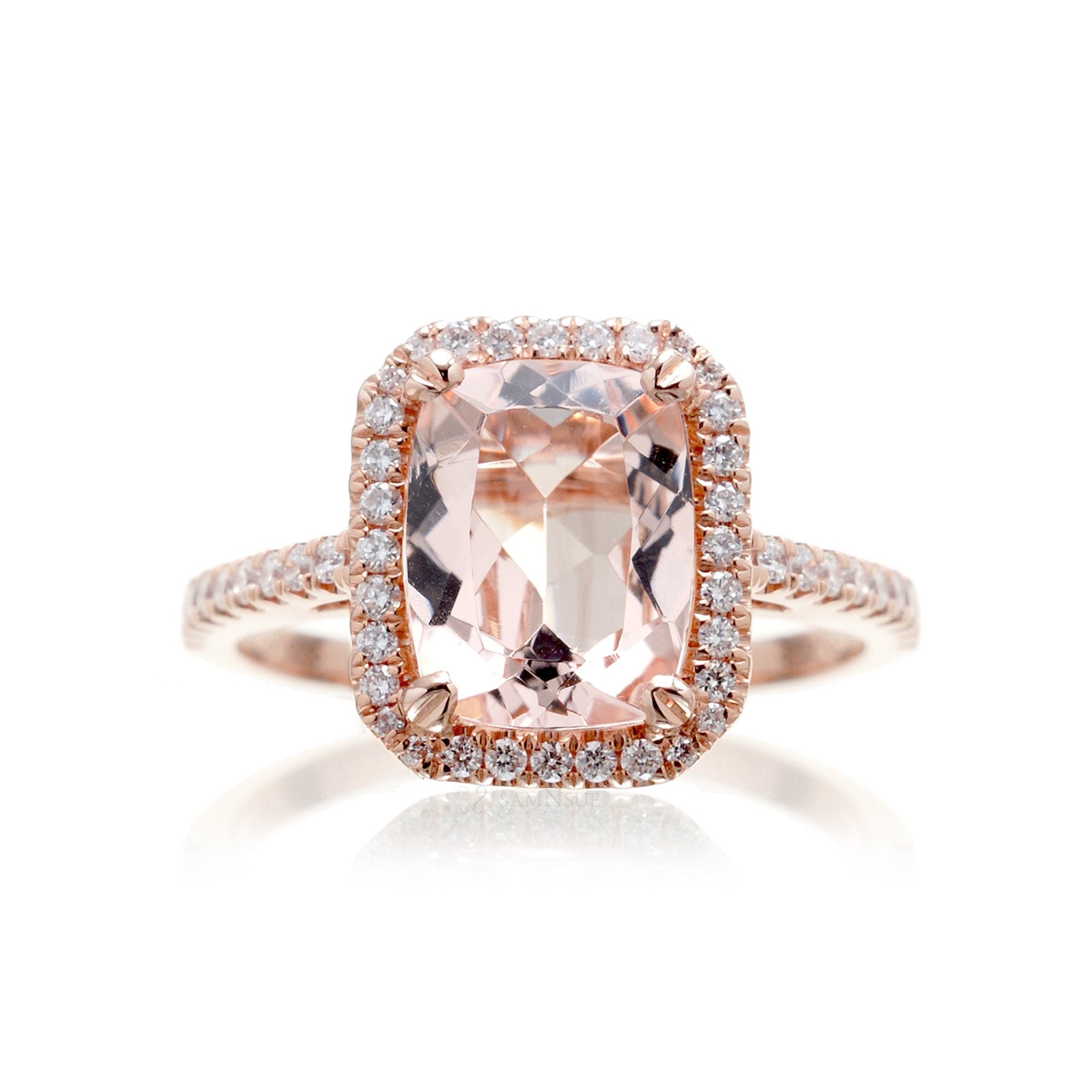 Cushion cut morganite ring with a diamond halo in rose gold