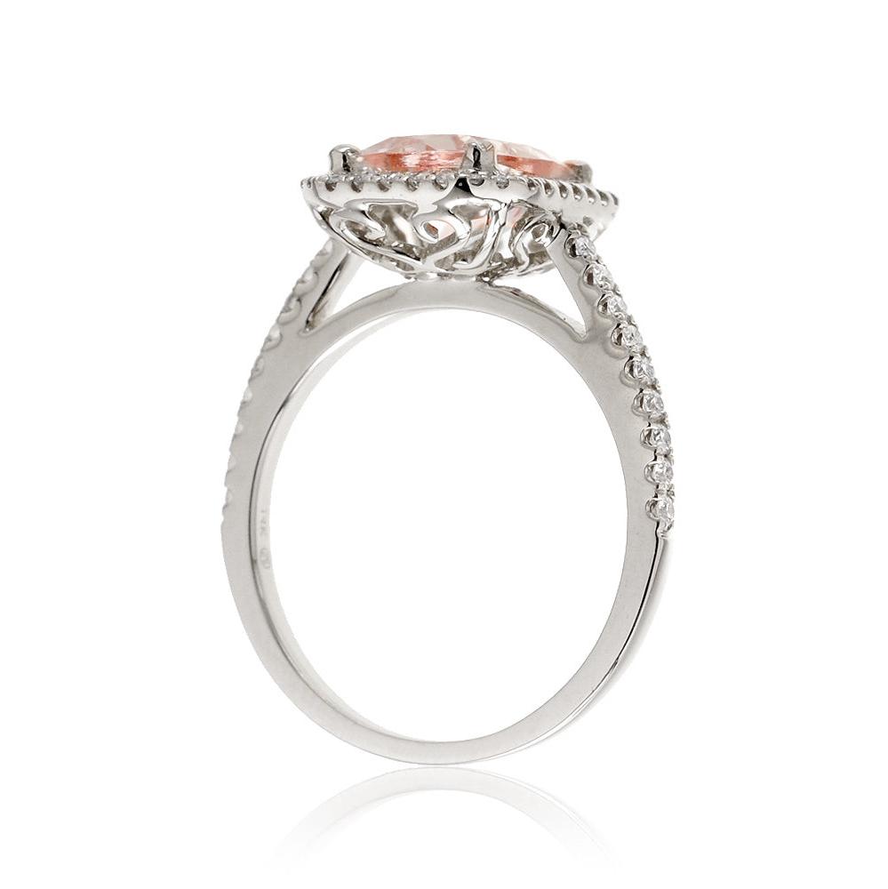 Cushion cut morganite ring with a diamond halo in white gold