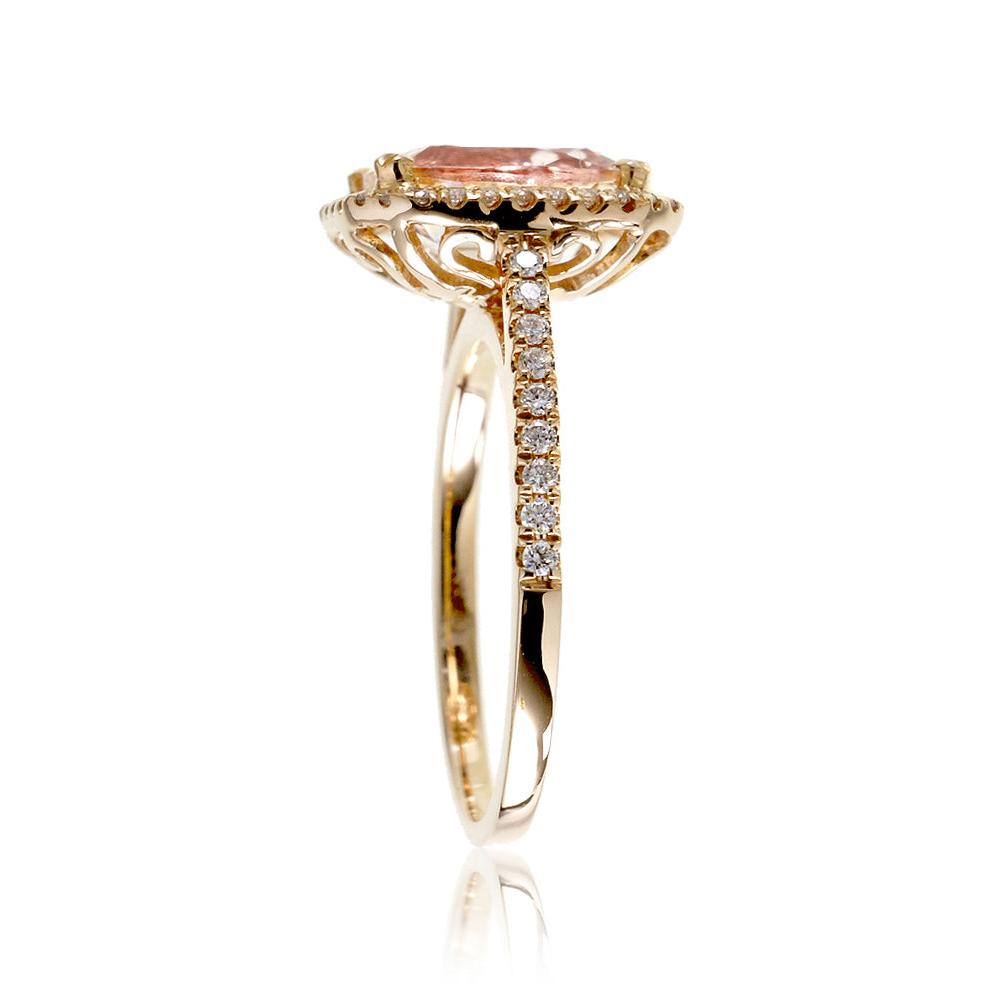 Emerald cut morganite ring with diamond halo in yellow gold