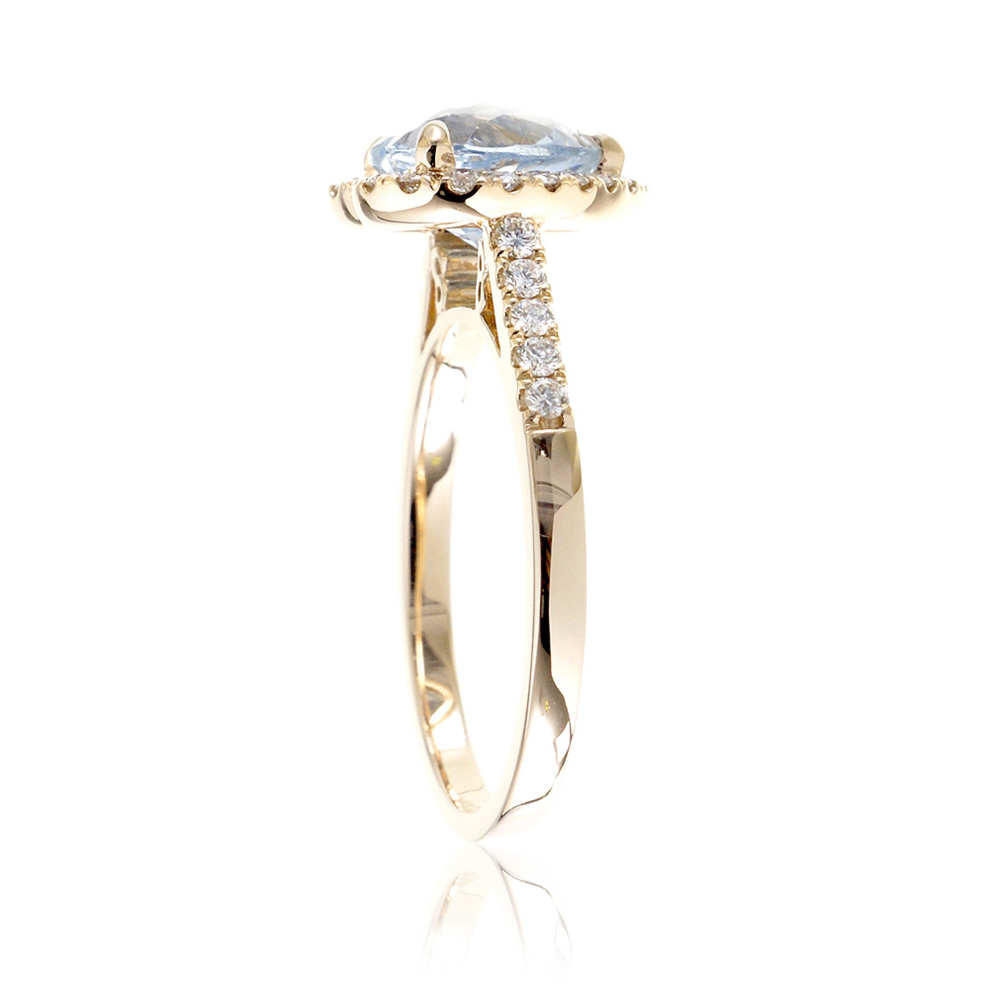 Heart aquamarine ring with diamond halo and band yellow gold