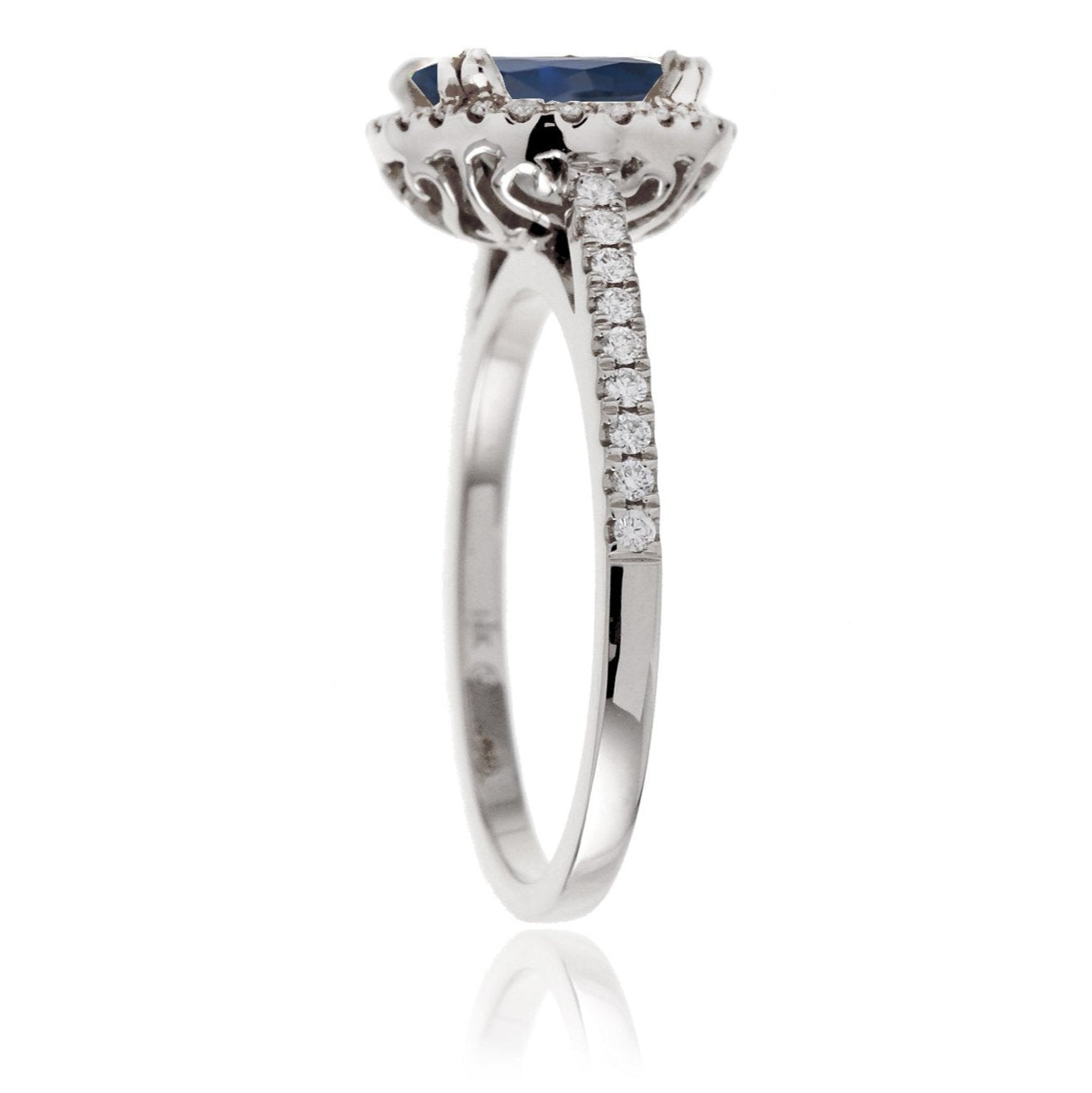 Oval shape blue sapphire ring with diamond halo in white gold