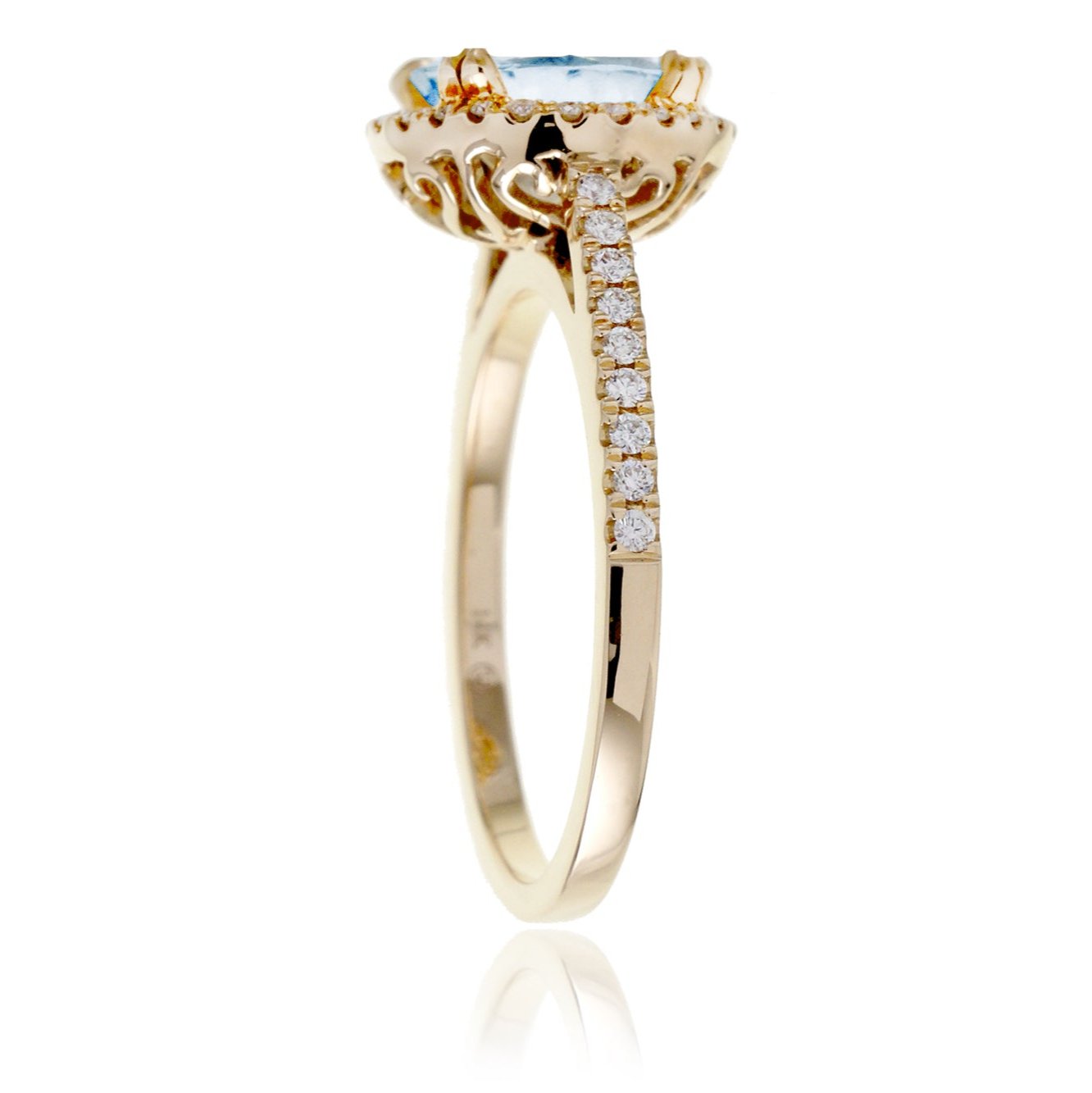 Round aquamarine ring with a diamond halo and cathedral yellow gold setting