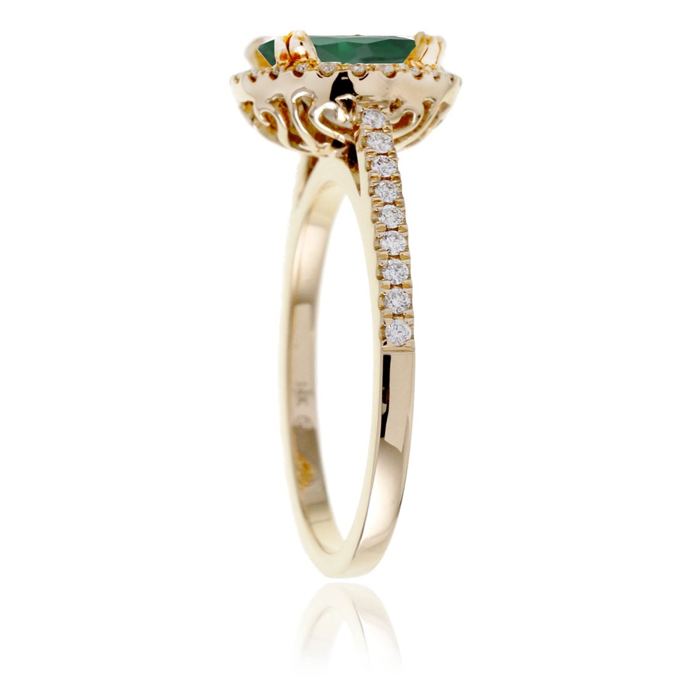 Oval cut green emerald engagement ring with a diamond halo in yellow gold