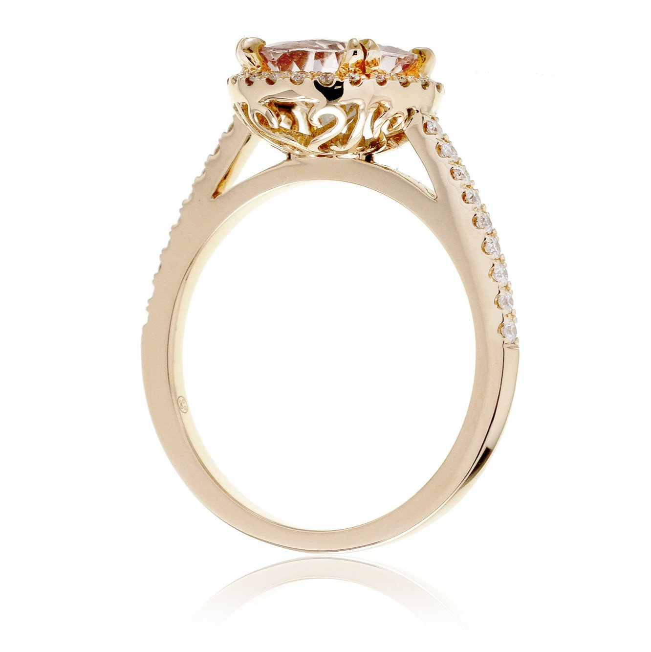 Round morganite diamond halo engagement ring in yellow gold