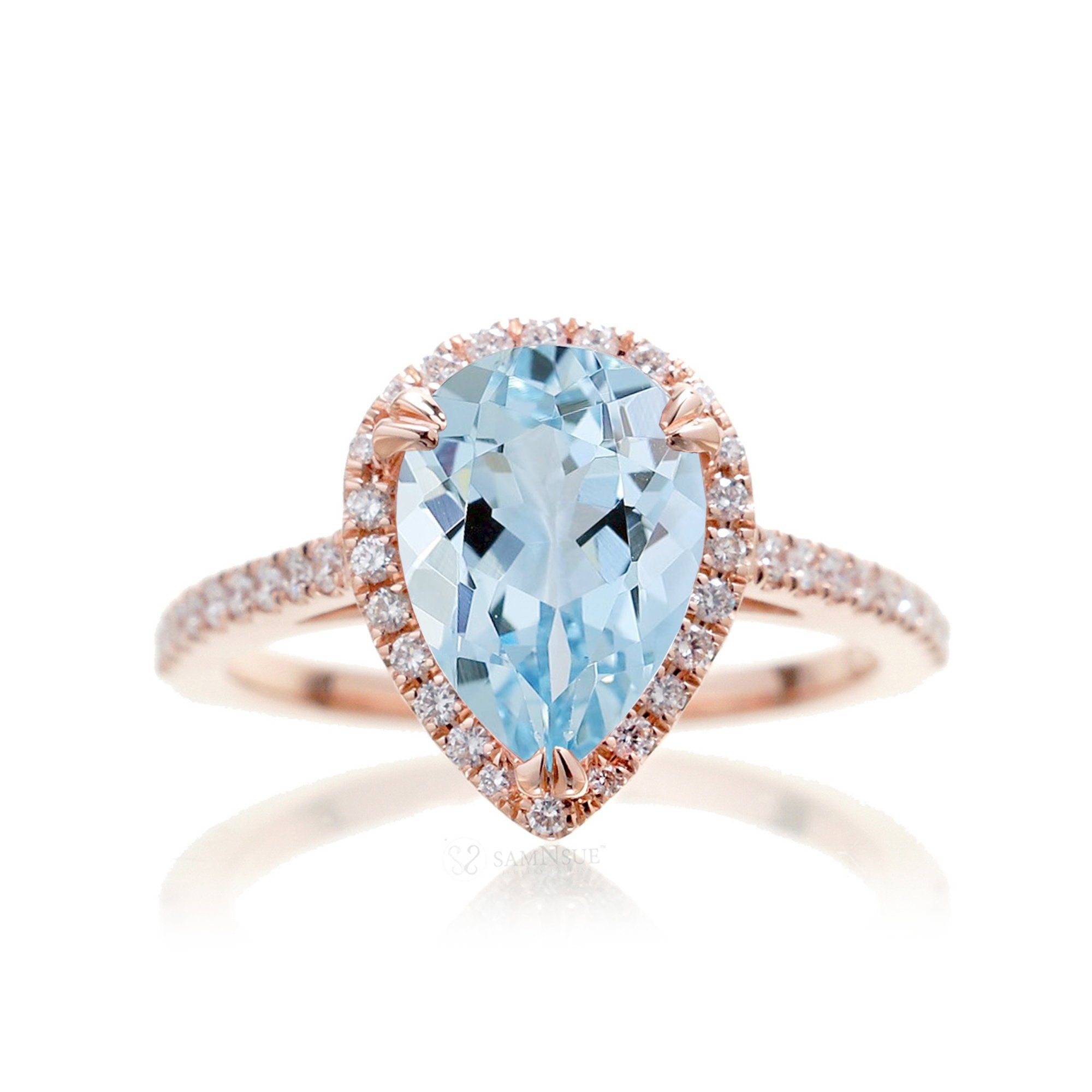 Pear aquamarine engagement ring with halo in rose gold