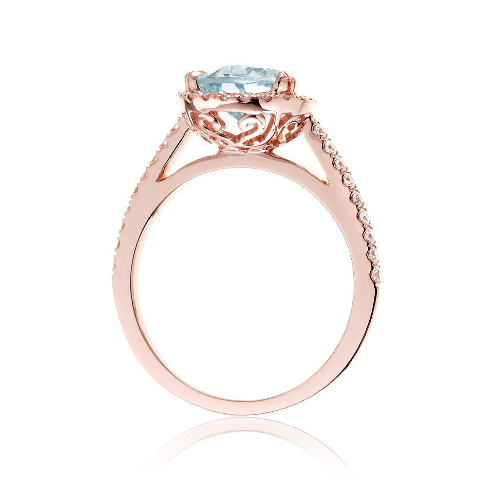 Pear aquamarine engagement ring with halo in rose gold