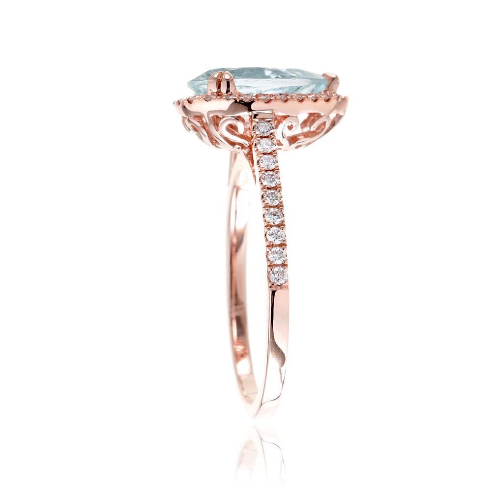 Pear aquamarine engagement ring with halo in rose gold