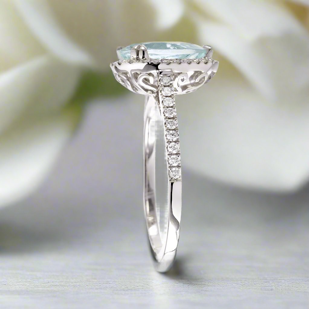 Pear aquamarine engagement ring with halo in white gold