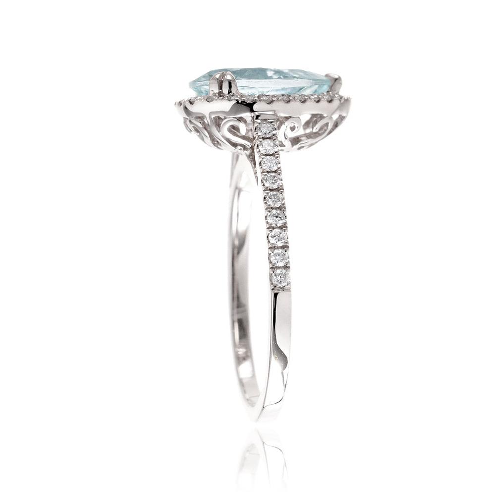 Pear aquamarine engagement ring with halo in white gold