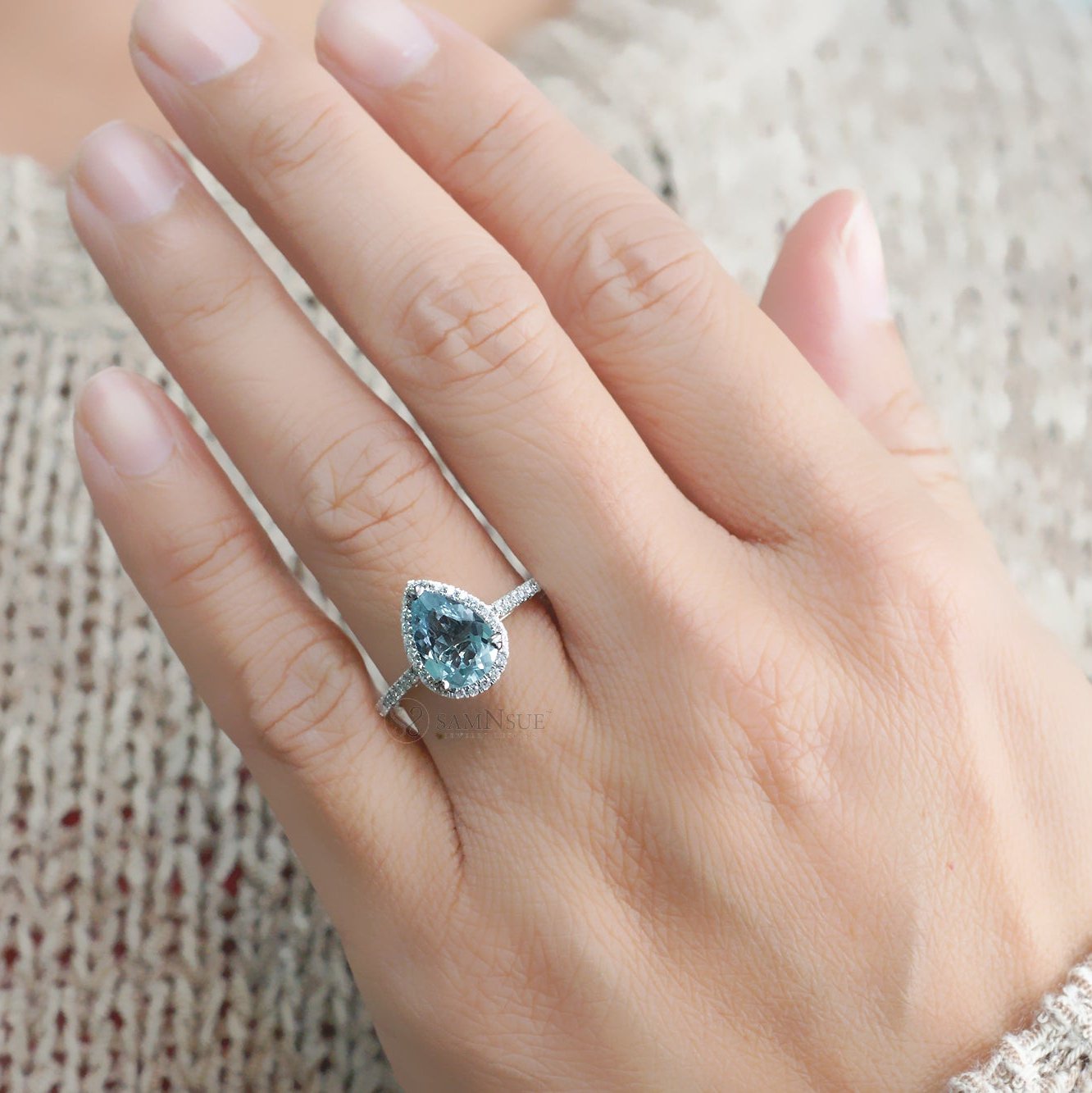 Pear aquamarine engagement ring with halo in white gold