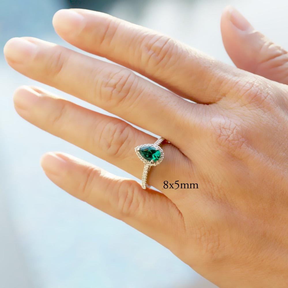 Pear shaped emerald on sale and diamond ring