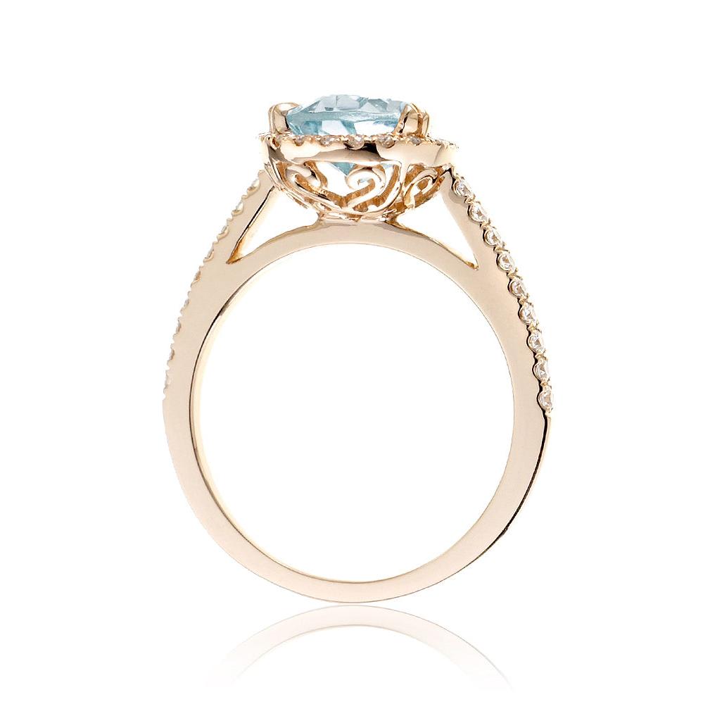 Pear aquamarine engagement ring with halo in yellow gold