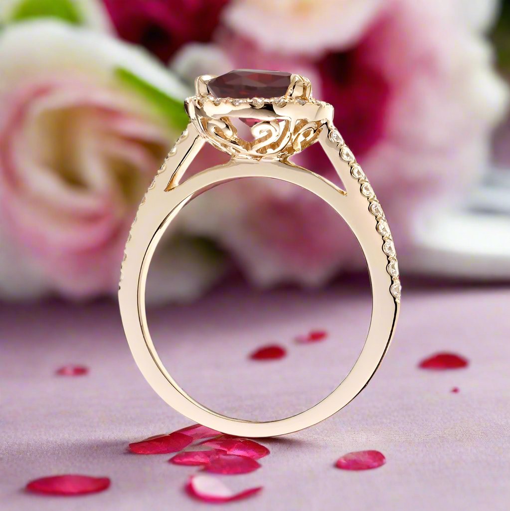 Pear ruby engagement ring in yellow gold