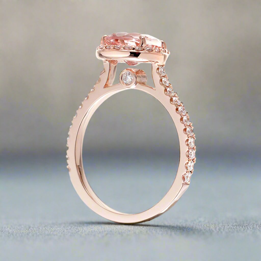 Pear cut morganite ring with diamond halo and band in the Sunset rose gold