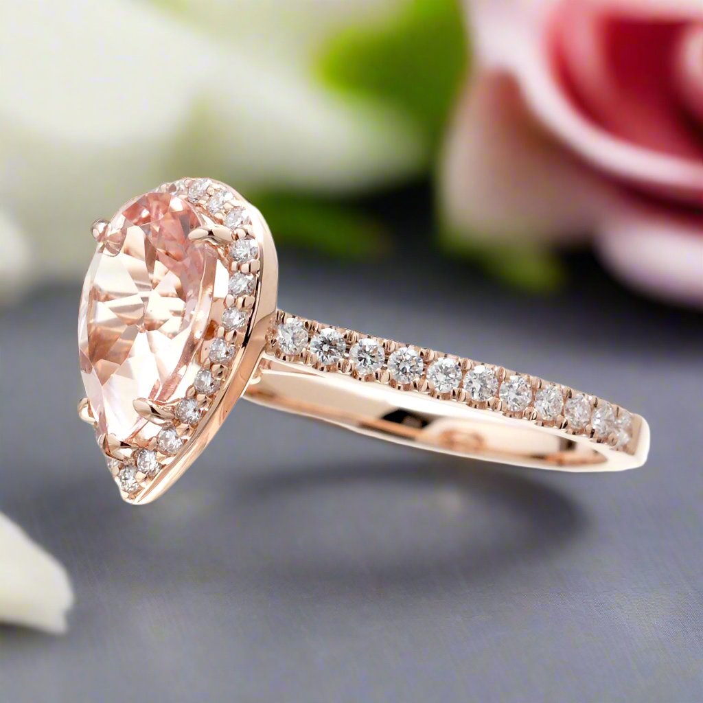 Pear cut morganite ring with diamond halo and band in the Sunset rose gold