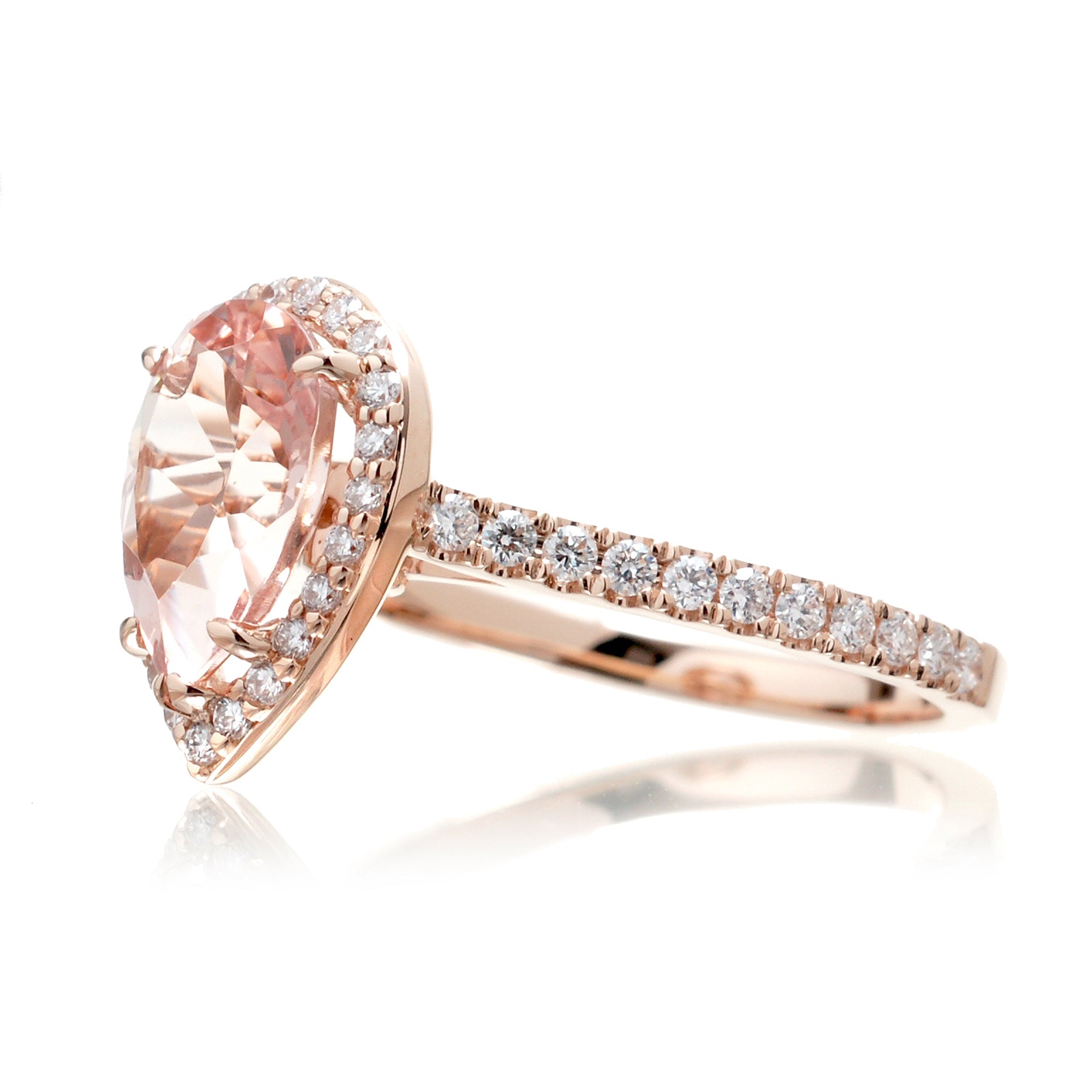 Pear cut morganite ring with diamond halo and band in the Sunset rose gold